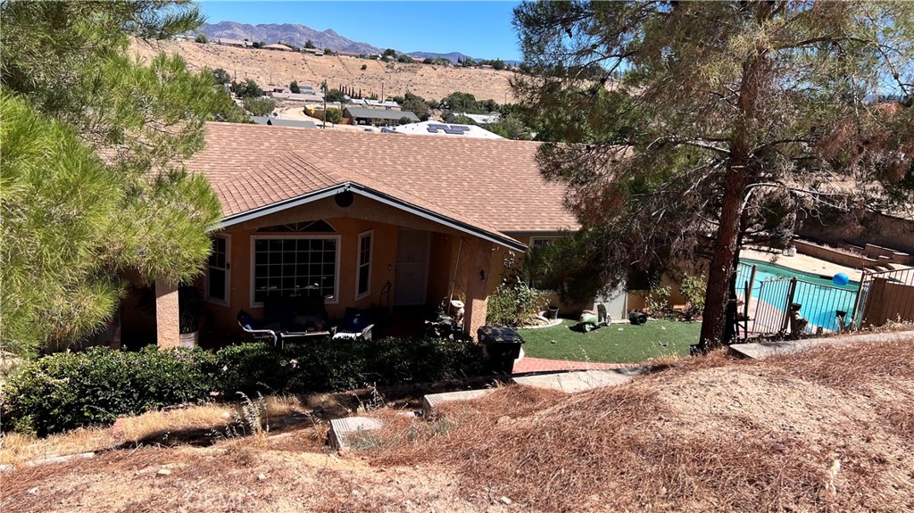 Welcome to your private retreat in Hesperia!
This charming 3-bedroom, 2-bath home offers 1,474 sq ft of comfortable living space, nestled on a spacious 28,280 sq ft lot. From the moment you arrive, you'll notice the unique downhill driveway leading to a peaceful and private setting — perfect for those who enjoy a little extra space and tranquility.
Enjoy sunny High Desert days in your beautiful backyard oasis, complete with a sparkling pool that’s ideal for relaxing, entertaining, or simply escaping the heat. The layout of the home is functional and cozy, offering natural light throughout and endless possibilities to make it your own.
Plenty of outdoor space for parking, gardening, or even future projects — the potential here is endless! Located just minutes from schools, shopping, and major roads, this home is a rare opportunity for buyers looking for value, land, and a place to unwind.
Don’t miss the chance to make this Hesperia gem yours — schedule your private showing today!