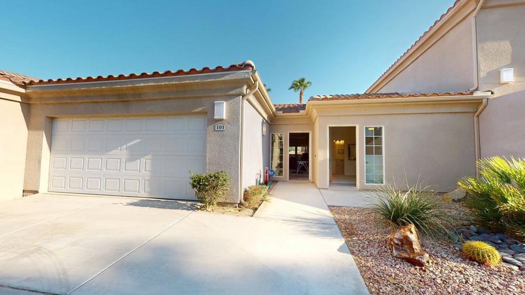 Located in Lantana at Cimarron - off of 30th Avenue - just south of Desert Princess Country Club and west of Landau Blvd, this 2 Bedroom 2 Bath end unit condominium home offers direct access to its own 2 car attached garage. No one above as well. This home exudes warmth and sophistication and the open great room, dining and kitchen - with no wall separation like other units currently listed in Lantana at Cimarron, is sure to please the most discerning buyer. The custom window coverings, with up-down shades, gives the unit a light and bright feeling along with a feeling of privacy. The huge kitchen featuring granite counters and a large breakfast bar is adjacent to the expansive dining area. No one needs to feel alone while entertaining in this great space. There is direct access to the south facing patio with glimpses of the mountains beyond as well as a picturesque desert landscaping leading to the communities' large pool and spa. The home features the primary suite with bath ensuite as well as a spacious primary closet. There is also the second bedroom suite with direct access to the second bath and it's own separate entrance at the front of the home - great for visiting friends and family. The spacious laundry room with side by side washer and dryer and plentiful storage plus the attached 2 car garage are added pluses. There is also ample guest parking across from the garage entrance. This lovely community is adjacent to the Cimarron Country Club too. This home is easy to show! Welcome to your new home!