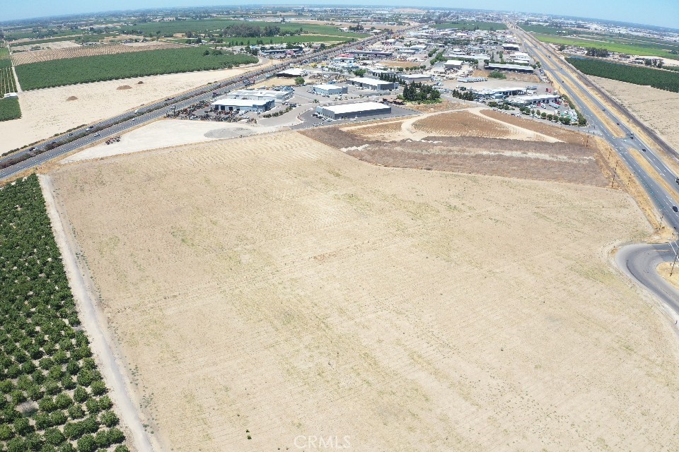 Discover an exceptional opportunity with this expansive 27.76 acre parcel of land, perfectly positioned adjacent to Golden State Boulevard with access to both Clovis Avenue and Hwy 99 north and south ramps. The property is located within a Federal Opportunity Zone. Not encumbered by the Williamson Act, the property allows maximum flexibility for future industrial or commercial uses. This property is strategically positioned within the Fowler sphere of influence, primary development area, and is adjacent to existing development. According the city of Fowler General Plan, the site is designated for heavy industrial use making it ideal for a range of industrial applications. PG& E supplies electricity to the parcel. The SFK sanitation sewer line runs along Golden State Blvd. There is a private water district which services businesses to the north of this parcel. City water line is to the south at Bonita. The property has surface water through Consolidated Irrigation District. There is an agricultural well and electric turbine pump ( not energized) on the property. The standing water level is around 100'. Minimal flood risk, above 500 yr. flood level.