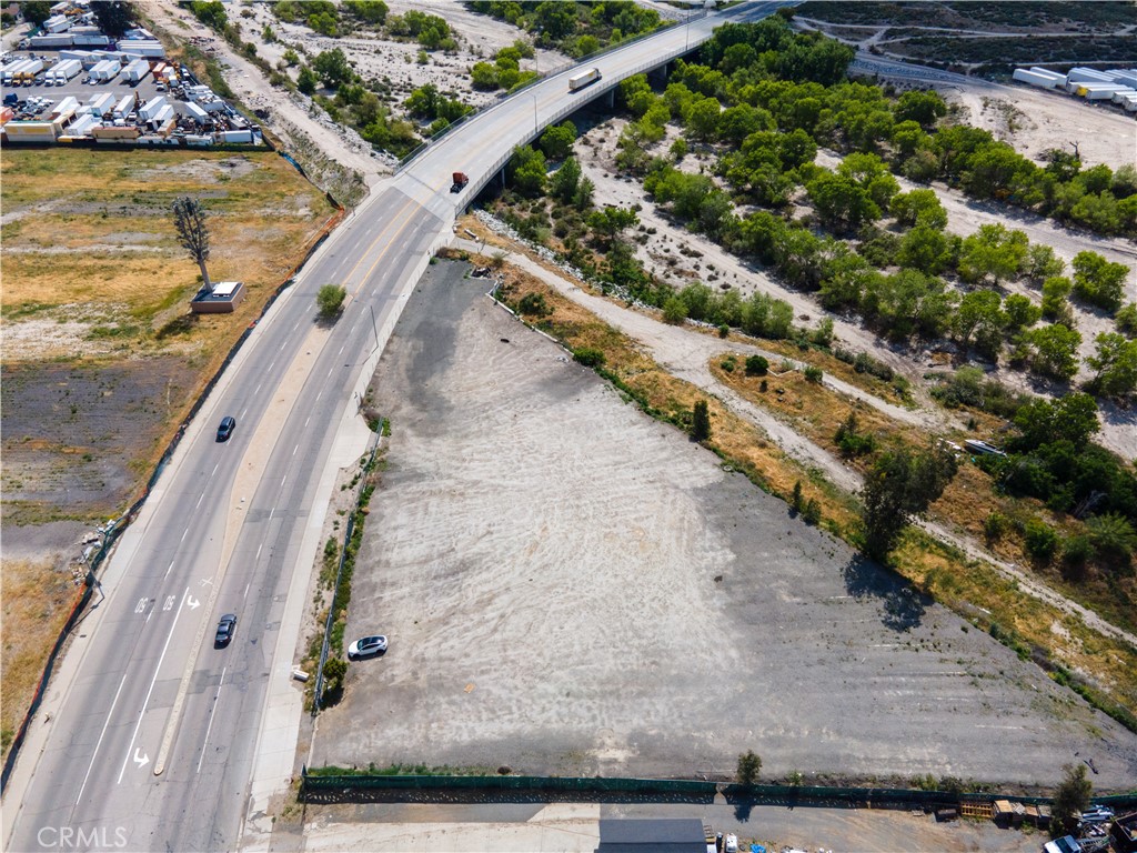 Presenting a Truck and Trailer Parking at 787 Orange Show Rd, San Bernardino, CA 92408. This expansive flat lot spans approximately 67,082 square feet (1.54 acres), offering an ideal canvas for a variety of potential uses. Strategically located near the 10 and 215 Freeways, the property boasts excellent accessibility, making it attractive for light industrial development, including truck parking (buyer to verify zoning and permitted uses). Don’t miss this exceptional opportunity to secure a large, usable parcel in the heart of the Inland Empire.