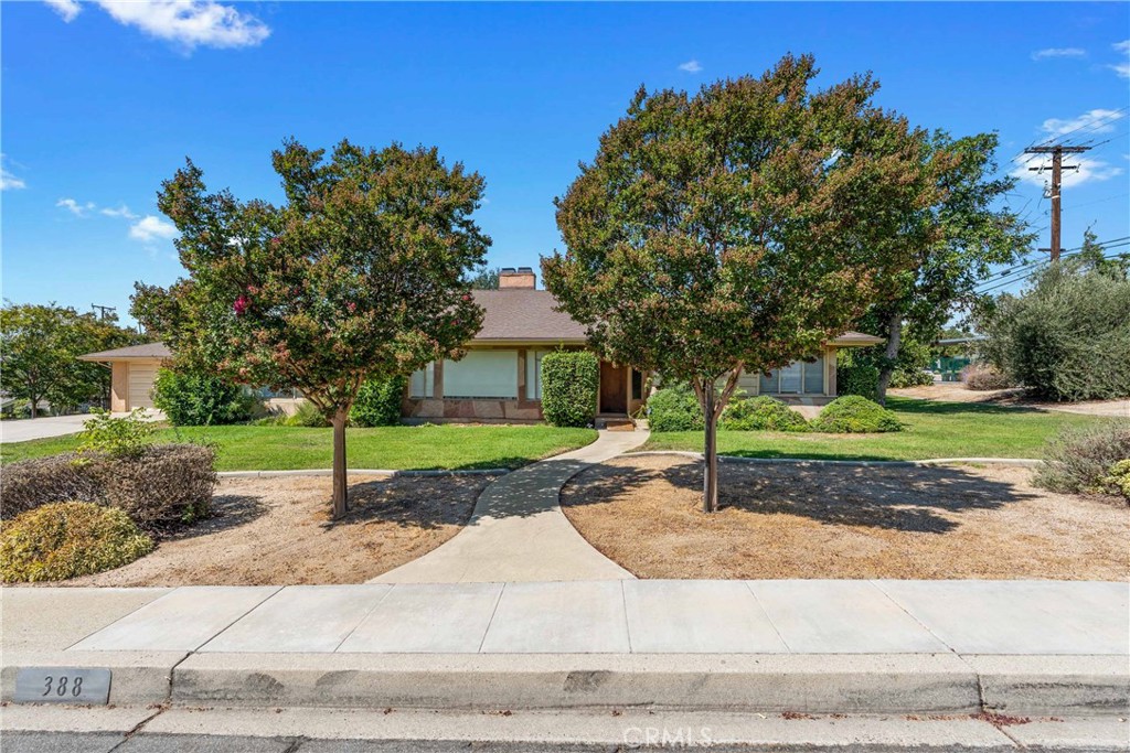 A single story, corner lot home on the North end of Upland, near Magnolia Elementary School. This home has great features and was built with great pride in the 50's. With 3 nice sized bedrooms and 2.5 bathrooms, this floor plan is well laid out and feels like a larger home. It consists of 2284 Sqft on a 14,000 sqft lot. There have been plenty of recent upgrades which includes: A brand new, 1 year old roof with a 10-yr warranty. An upgraded copper water lines. An upgraded 200 AMP electric panel. The home has a large family with fireplace that extends out to the formal dining room. A separate living room with fireplace that overlooks the kitchen. A kitchen with tile flooring, tile countertops and lots of cabinetry. Double oven and an electric stove top. There are an indoor laundry room and half bathroom off the kitchen. A large front corner lot yard with lushes’ plants and trees including an avocado tree. There is a breeze way that leads to the 2-car garage. Plus, a large covered patio that overlooks the backyard lawn and mature trees. A great hoe in a great Upland neighborhood.