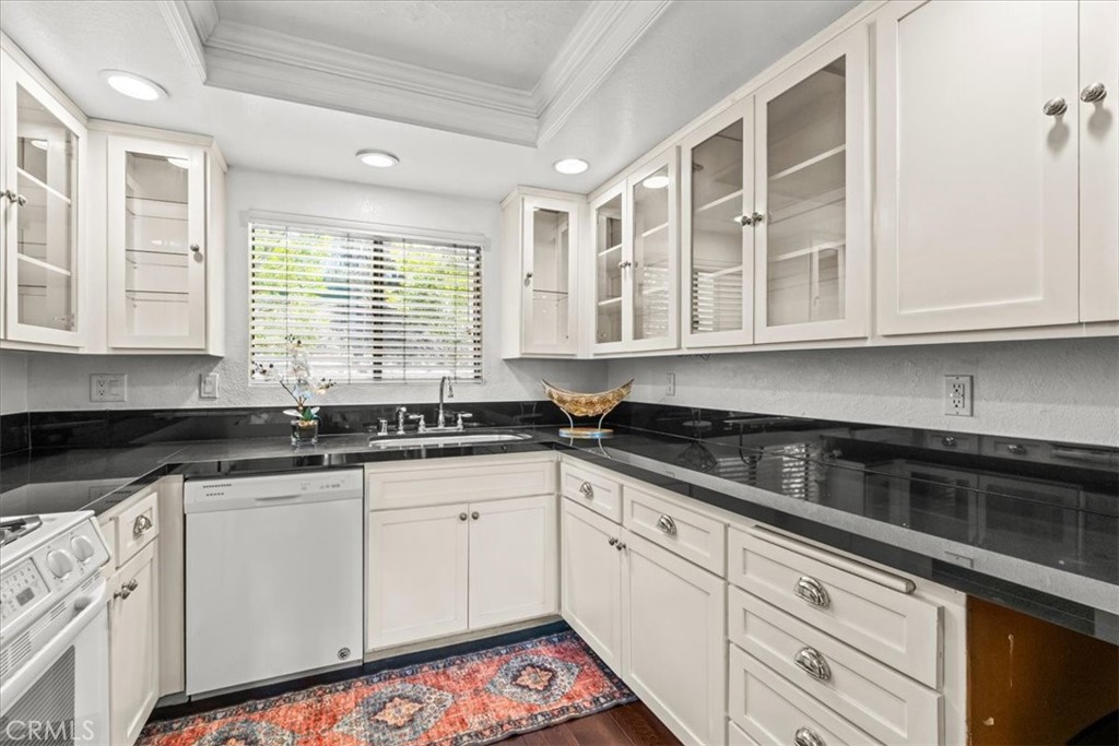 Welcome to Signal Hill, featuring a gorgeous and spacious end-unit condominium with amazing views in the NorthView Community. The spacious 2 bedrooms / 2 full bathrooms unit offers a spacious modern and upgraded appeal with an open floor plan. A well-equipped kitchen with plenty of cabinets for all your storage needs and elegant granite counter tops, a convenient separate laundry area for regular size washer and dryer. Flow into the dining area to the spacious living room space with a cozy fireplace. Living room with access to a private balcony. The two spacious bedrooms offer extra space, perfect for big furniture, office space or small retreat area. Primary bedroom with walk-in closet and access to private balcony. Private balcony offers Tennis court and Pool Views. The community is centrally located with close proximity to Costco, Costco Gasoline, multiple other stores, grocery stores, shops, Hilltop Park, 405fwy and so much more. HOA covers; Two subterranean-gated parking spaces, pool, spa, clubhouse, Pickleball court, 24hr video surveillance, TRASH, WATER and sewer. The unit faces Combellack Dr. Do not wait on the sidelines, this community has one of the LOWEST HOA dues around this area. Call for a private showing today.