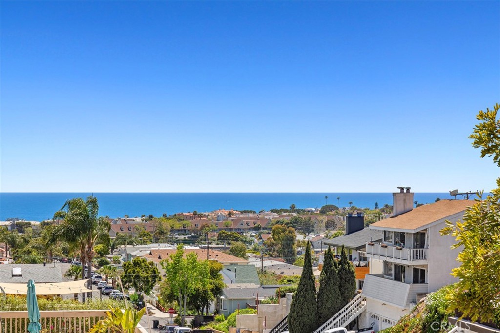 Available now, this immaculate 2-bedroom, 2-bath home is ideally located in Dana Point’s sought-after Lantern District and offers stunning ocean views across 1,000 square feet. The open-concept living area is bright and inviting, featuring easy-care flooring throughout with no carpet in sight! The spacious kitchen includes granite countertops, ample cabinet and counter space, a cozy dining area, and brand new stove and microwave. Both bathrooms have been updated with granite finishes and classic white subway tile, and you'll enjoy newer appliances and windows throughout the home. The bedrooms are generously sized with laminate flooring, great closet space, and the primary suite includes its own private en suite bath. Pride of ownership shines throughout the pristine interior. A rare find, this home also includes a large private 2-car garage. Just a short walk to downtown Dana Point, the harbor, and beautiful local beaches.