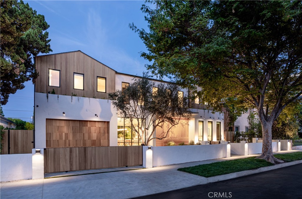 Perfectly Curated New construction on a quiet cul-de-sac within a premier Encino location. This estate perfectly blends cutting edge amenities and warm organic design elements while providing ultimate comfort. Expansive open floor plan and soaring high ceilings flood the home with natural light. Exquisite chef's kitchen displaying an oversized center island with breakfast seating, top-of-the-line Thermador appliances, and custom built oak cabinetry. In addition, the main level offers a spacious home office with a separate entry, and a fully-equipped movie theater perfect for family movie nights. Luxurious primary suite offers a massive walk-in closet, and spa-like bathroom with soaking tub, walk-in shower, double vanity counter space, and an enclosed patio perfect for relaxation. The entertainers yard features a sparkling pebble-tech pool/spa, ample grassy area, built-in BBQ and fire pit lounge area. Home is gated for maximum privacy, and equipped with a Control 4 Smart system, solar panels, surround sound, and security cameras throughout.