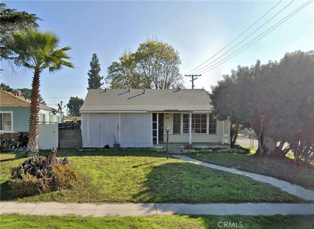 Fantastic purchase opportunity on this 2 br 1 ba corner lot home with 2 car attached garage. Original wood floors in living room, dining area and bedrooms, kitchen with eating area and tiled countertops, den with fireplace and a large backyard. Property is sold in its' "As Is" condition with full disclosure of City of South Gate Pre-Sale Property Report. Don't miss out!
