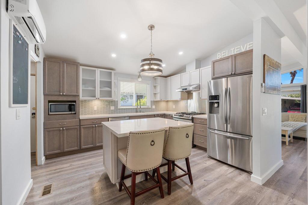 Welcome to Family Friendly Sky Valley Resort! This gorgeous completely remodeled manufactured home is located steps from the main pool and clubhouse! Featuring, new roof, new plumbing, new 2-system air conditioning, (A 20k upgrade alone) you have the quiet energy efficient mini-split system as well as a new standard unit. If one system should break you will be covered by the other system! New laminate flooring throughout (No Carpet) Custom dual pane tinted windows in the living room and new dual pane windows throughout, a retractable exterior sunshade for the living room windows, no popcorn ceilings, all new ceiling fans and lighting, new interior paint, new baseboards, water filtration system, Nest smart system thermostat, ample storage shed, extended fully covered patio covers on both sides, custom front gates for privacy with vinyl fencing, perfect for dogs, or children! The kitchen boasts upgraded soft close cabinets, stainless steel appliances, quartz countertops with a beautiful entertaining island, and designer back splash! The living room is tastefully furnished with high ceilings, an individual laundry room and mud room with a LG stainless steel washer/dryer set. The guest bedroom comes furnished with mirrored wardrobe closet doors. The guest bathroom has soft Desert shade new Corian vanity, and a stunning beveled subway tile shower with a custom soap niche and glass shower doors. The primary bedroom is huge with a walk-in closet and a custom barn door entrance to the grand primary bathroom that has quartz countertop vanity, and a separate toilet room for privacy and an ''Over the Top'' walk in shower with custom plank tile, custom soap niche, pebble flooring and glass doors! Quality craftsmanship throughout with beautiful, finished touches throughout. Seller has respectfully pressure washed the exterior, had the concrete cleaned, washed all the windows and had the interior professionally cleaned for the new buyer. Low monthly space rent of 1,020.00. Located in Sky Valley Resorts gated community that offers its rare and healing mineral waters in the pools and spas, state of the art pickleball, tennis, dog park, gym and more! A short drive to quaint downtown Palm Springs, fine shopping and dining on El Paseo, Indian Wells tennis tournaments, PGA golf, La Quinta art festivals, ice hockey and concerts at the new Acrisure arena, Coachella and Stagecoach music festivals. Perfect warm winter getaway or permanent home!