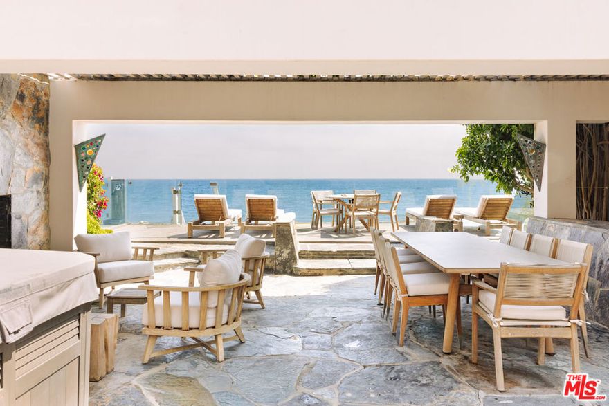 Bold design and modern features coalesce in this newly remodeled three-story beach house. Located in the guard-gated community of Malibu Colony, this 5 bedroom/5 bath home w/custom stone floors, fabric walls, and hand-selected designer elements. Perfect for grand or casual living, the home offers a custom aquarium entry that flows into a sleek, but inviting formal living room and dining area with raised fireplace and floor-to-ceiling wall of glass that opens to a logia covered entertainer's deck with a BBQ island, multiple seating areas and raised wood sun/viewing deck with direct beach access. Black granite, ocean view gourmet kitchen with custom stainless steel finishes and high-end appliances. Intimate family/media room with granite bar area. Gorgeous, ocean view owner's suite with sitting area, high ceilings, and double spa-like baths, plus a third-floor equipped gym that overlooks the suite. Four additional en-suite bedrooms, two-car garage with guest parking. Also for lease $75,000/month.