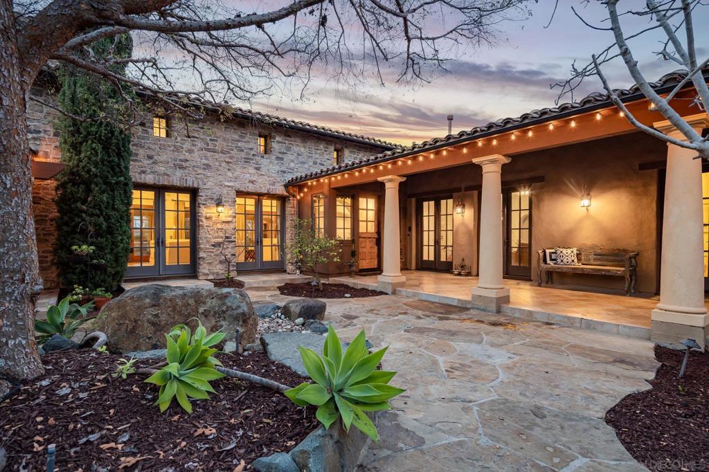 This exceptional 8-bed, 8-bath estate is the ultimate family compound in the guard-gated community of Santaluz. Designed with one of the most desirable open floor plans, it offers seamless indoor-outdoor living. Two private casitas provide space for visitors, while a vineyard and fruit trees create a serene retreat. The resort-style pool and spa make it perfect for entertaining. This home also features paid solar, ensuring energy efficiency and lower utility costs. Residents have the opportunity to join The Santaluz Club, which offers a private championship golf course, luxurious spa services, fine dining, and a variety of recreational activities for all ages. A perfect blend of elegance, comfort, and resort-style living.