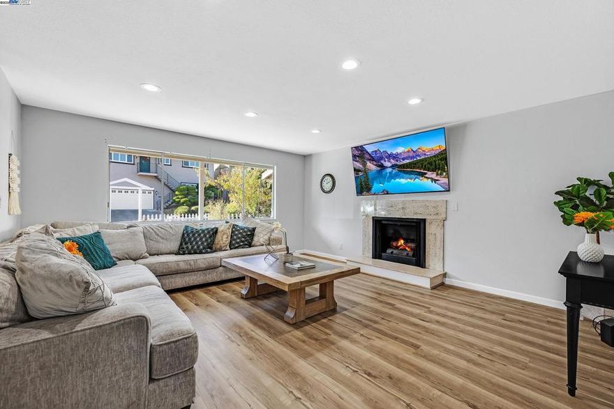 Views, views, and more views! Come see this exceptional, light-filled home perched above the hills of Castro Valley with the sweeping vistas this neighborhood is known for. Step onto one of your two private decks and take it all in. The main level features an open living room with a modern kitchen and family room combo perfect for hosting. Three spacious bedrooms, a full bath, and a junior suite with a walk-in closet complete the floor. Just a few steps down, retreat to the primary suite with its own walk-in closet, plus a bonus room nearby that works beautifully as a nursery or creative space. Large windows and recessed lighting bring in incredible light throughout. The lower level offers a generous recreation room equipped with a second kitchen ready to flex into your dream space, theater, gym, or multi-generational living. It delivers opportunity and versatility.  Two separate entrances give options for split-level living or rental! All of this and just minutes from top schools, BART, freeways, shops, restaurants, and Lake Chabot. This home offers lifestyle and convenience in one rare package. If you're looking for a home that checks the boxes and gives you that instant 'this is the one' feeling, this could be it!