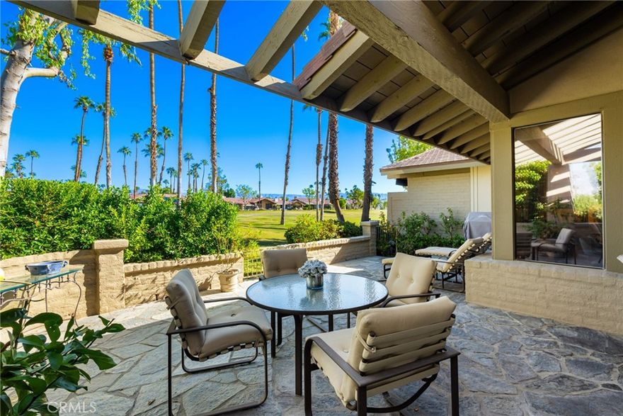 Welcome to The Lakes Country Club – Desert Living at Its Finest! Step into this extraordinary, expanded Santa Fe floorplan, reimagined for modern comfort and sophistication. Spanning approximately 3,144 square feet, this 3 bedroom, den, and 5 bathroom home offers the perfect balance of luxury and functionality. The gated side yard welcomes you with a lush, private oasis complete with a soothing water feature and peek-a-boo mountain views – an ideal setting for relaxation or entertaining. Upon entry, you’ll be greeted by soaring vaulted ceilings, a warm and inviting color palette, and oversized porcelain tile flooring throughout the main living areas.The living space radiates elegance with accent stone walls, a striking fireplace, and a stylish wet bar – perfect for hosting or unwinding in comfort. The heart of the home is the chef’s kitchen, thoughtfully designed with custom cabinetry, high-end Wolf/Sub-Zero appliances, and an oversized island with seating to accommodate both intimate meals and grand gatherings. Adjacent to the kitchen, the patio features seating for twelve, making indoor-outdoor entertaining a breeze. All bedrooms, including the den, feature en-suite bathrooms for ultimate privacy, while an attached casita offers a separate entrance for guests. Whether hosting family, friends, or enjoying a quiet retreat, this home delivers effortless luxury. Offered turnkey and furnished, this stunning property allows you to immediately immerse yourself in The Lakes’ unparalleled lifestyle. The Lakes Country Club offers a robust schedule of social and fitness activities at the exquisite Clubhouse and Health and Wellness Center. Enjoy Tennis, Pickleball or Pop Tennis, Bocce or the 44 community pools and spas. For golfers, the Club offers membership options for the 27 hole championship golf course. Don’t miss this rare opportunity – schedule your private tour today and make your dream home a reality! SHOWINGS TO BEGIN OCTOBER 15