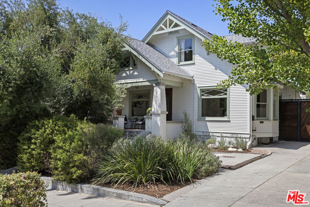 In the heart of historic Angelino Heights, this lovingly restored storybook 1924 Craftsman is alive with warmth, character and just the right amount of magic. With a legal second unit and timeless charm throughout, 932 West Kensington is something of a unicorn.The sun-drenched main home features 3 bedrooms and 2 baths, lovingly updated while maintaining all original woodwork and craftsman detailing. The dining room is wrapped in windows and anchored by a beautiful built-in cabinetry, flowing through to the designer remodelled kitchen. A flexible den or third bedroom and a full bath with classic tile complete the first floor. Upstairs, two spacious bedrooms, each with walk in wardrobe, share a full second bath. The curious guest will be thrilled to discover a finished playroom/meditation hideaway off of the front bedroom. The large basement features the washer dryer, full work bench and all the storage space you could possibly hope for.The newly landscaped backyard is lush and private, filled with succulents, fruit trees a true city hideaway. The converted garage offers endless possibility as an office space, playroom or even as an additional ADU.Only adding to the magic: 934 W Kensington Rd sits directly behind and through the garden gate. A charming 1-bed, 1-bath, legal Unit with its own succulent lined private street entrance and newly landscaped front yard. The sister house, just a few years younger than 932 shares many of the same loving craftsman finishes from built in cabinetry, a classic California kitchen complete with O'Keefe and Merritt stove and it's own Laundry Room. A dream landing spot for your family from out of town or a truly desirable rental unit. Just a stones throw from Echo Park Lake, Woodcat Coffee and the rest of Sunset Boulevard's offerings, this really isn't one to miss.