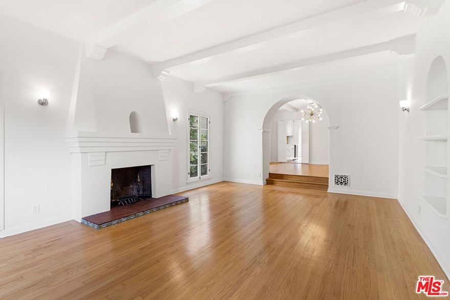 Welcome home to the charming, 3 bed, 2 bath lower unit of this classic Spanish revival duplex in the heart of Beverly Grove.  The common areas all on a grand scale with gorgeous hardwood floors throughout.  The living room with fireplace features a classic bookcase and front patio.  Double doors open to an expansive bonus room along side of the living room. On thefar side there are steps that lead up to the dramatic formal dining room, the bright completely remodeled kitchen with all new appliances, the adjoining sunny breakfast room  and roomy separate service porch with washer dryer and storage.  The primary bedroom has a new en-suite bathroom with shower.  The second hall bath features vintage tiles with a tub and seperate shower.  Nice sized bedrooms and an abundance of closets complete this lovely home. Steps from 3rd St . Property is within minutes of Beverly Hills, Century City, The Grove and Hollywood.  25 minutes from DTLA,the beach or LAX. Walk to shopping & restaurants, Trader Joe's, Farmers Market just  5 minute walk away. Exterior recently painted different from photos shown