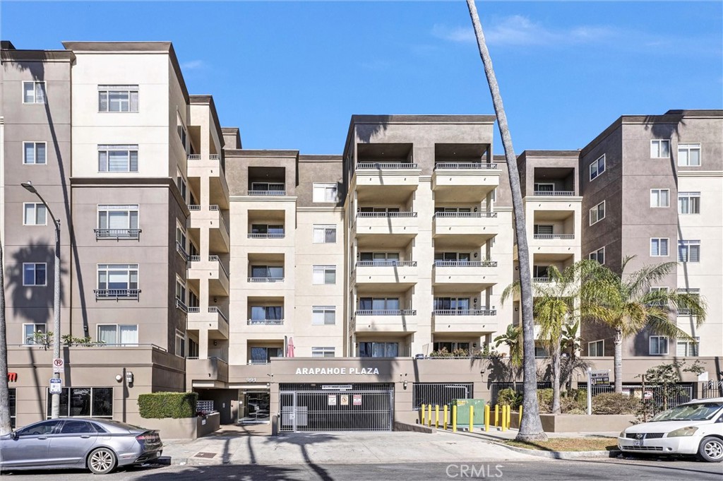 WELCOME TO ARAPAHOE PLAZA! This is a controlled-access building with 2nd floor location ideally located near Koreatown & Downtown LA! This 3 bedroom/2.5 bath unit offers 1,700 SF of bright, open living space and features a spacious floor plan with an abundance of natural light, high ceilings and tasteful finishes throughout. The expansive living and dining areas flow seamlessly to a private balcony with city views – perfect for entertaining and relaxing. The primary bedroom has been thoughtfully isolated off the living room and features another private balcony, two sets of mirrored closets sliders provide access to the open and modern private bathroom featuring dual sinks, an extra deep tub and separate stall shower. The modern kitchen includes a serving bar, granite countertops, ample cabinetry and stainless steel appliances. The remaining two bedrooms are on the opposite side of the unit and provide flexibility for guests, a home office, or a growing household. Additional highlights include in-unit laundry, gated 2-space tandem parking (space #9) and community recreation/exercise room. This is an exceptional opportunity to own a spacious unit in one of LA’s most dynamic neighborhoods – close to major freeways with quick access to dining, shopping and entertainment.