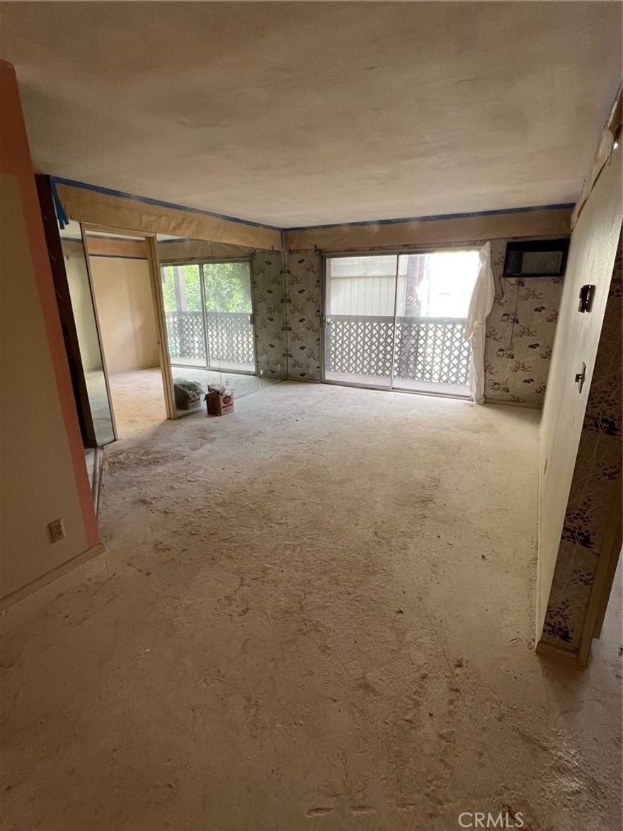 HIGHLAND PARK FIXER-UPPER & PROBATE SALE: Your Blank Canvas in a Prime NELA Location! This is the opportunity you've been waiting for! Located in the highly sought-after Arroyo Seco Village Community in vibrant Highland Park, this 2nd-floor condo is ready for a full-scale renovation. This unit has been stripped down to a blank slate, offering an unmatched value-add proposition for investors or an end-user ready to design their dream home.

The interiors are completely primed for your vision: all flooring has been removed, the kitchen is distressed and needs all-new cabinets and appliances, and the bathrooms require complete updating, including addressing exposed drywall in the primary bath (due to a past leak). This is your chance to install the custom floors, designer kitchen, and luxurious bathrooms you’ve always wanted. Enjoy a leisurely lifestyle just steps from Highland Park's best. You're minutes from the trendy shops, eclectic eateries (including many vegan options), and vibrant nightlife along Figueroa St and York Blvd. The secure, gated Arroyo Seco Village complex offers exceptional amenities, including an elevator for easy access to your second-floor unit, a pool, spa/Jacuzzi, BBQ areas, and lush grounds. The unit includes one assigned parking space. Plus, you have the convenience of in-unit washer and dryer hookups. With a median home price over $1M in Highland Park (90042), this is a rare chance to enter the market at a builder's price and customize a premier residence. Bring your contractor and your design dreams! Listing Broker represents Seller Exclusively. Please connect with your favorite realtor to scheduled a showing. ALL Information is in the MLS. ** CASH ONLY **