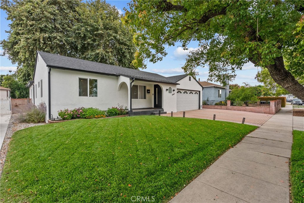 Fully Remodeled Home in Arleta!! This single-story modern home offers 4 bedrooms, 2 bathrooms, across 1443 sq.ft of a beautifully designed living. The open concept interior features sleek quartz countertops in the kitchen with stainless steel appliances, decorative backsplash tile & ample cabinetry. LED lighting, and waterproof wood flooring in the living room and bedrooms. Enjoy the serene finishes throughout including custom interior doors, double-pane windows, and a spacious bedroom with dual walk-in closets. Two brand new custom bathrooms, new dual central air and heating system & newly installed laundry room. Enclose patio for additional living space that can be used for a bedroom, office or work-out room. Outside, a generous 7,012 sq.ft. lot includes lush landscaping with automated sprinklers. Attached two-car garage ready for your next ADU project. Close to 5 & 170 Freeways.
