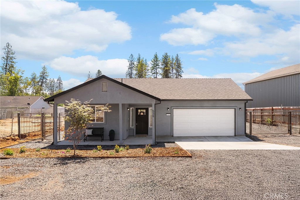 Welcome to 538 Sunset Drive, a brand-new 2025 build offering 3 bedrooms, 2 bathrooms, plus a dedicated office, all in one of the most sought-after streets in Paradise. Just one block from the renowned Billie Park, where you can enjoy scenic trails, a vista point overlooking Butte Creek Canyon, a playground, picnic areas, and wide-open grassy space, the location is truly unmatched. From the moment you arrive, the inviting covered front porch sets the tone, offering the perfect spot to sip your morning coffee and wave to neighbors. Step inside and you’ll be greeted by a bright, open-concept design that seamlessly connects the living, dining, and kitchen areas. The spacious living room is ideal for relaxing or entertaining, and the sleek electric fireplace adds warmth and ambiance at the touch of a button. A sliding glass door off the living space fills the home with natural light and creates easy access to the outdoors, perfect for indoor-outdoor living. The dining area flows effortlessly into the kitchen, keeping everyone connected. Designed with both style and function in mind, the kitchen boasts crisp white cabinetry, granite countertops, stainless steel sink, pots and pan drawers, two lazy Susans, and a modern electric range, making meal prep a joy. Down the hall, two generously sized guest bedrooms and a full hall bathroom provide plenty of space for family or visitors. At the end of the hallway, the private primary suite becomes your retreat. Here, you’ll find a large walk-in closet, an en-suite bathroom with dual sinks, and a slider leading to the backyard. One of the standout features is the attached bonus room, ideal as a home office, nursery, gym, or even a second oversized closet, the possibilities are endless. The backyard is a blank canvas waiting for your imagination. Whether you dream of a lush garden, a pool, an outdoor kitchen, or simply wide-open space for kids and pets to play, there’s room to bring it to life. Custom iron gates flank both sides of the home, and one oversized gate offers secure RV or boat parking, an amenity rarely found in new construction. With its unbeatable location, thoughtful design, and modern finishes, 538 Sunset Drive isn’t just a house; it’s an opportunity to create your dream lifestyle in Paradise.