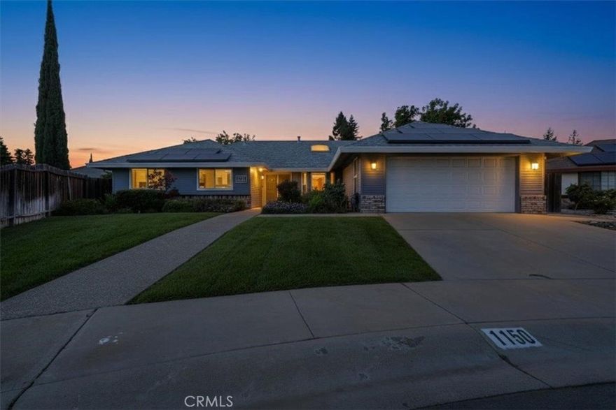 Welcome to this beautifully updated ranch-style home perfectly situated on a quiet cul-de-sac with convenient access to main roads. Step inside to an airy great room with vaulted ceilings, seamlessly connecting the living, dining, and kitchen areas for effortless flow and comfort. The completely remodeled kitchen (2024) shines with newer stainless-steel appliances, abundant cabinetry, and a large skylight that fills the space with natural light. Just off the kitchen, you'll find a versatile bonus room perfect as a bar, game room, or man cave. The spacious primary suite offers plenty of room for a desk or sitting area, along with three full-sized closets with built-ins and a recently remodeled ensuite bath. Both bathrooms were updated in 2021 with solid-surface countertops, stylish vanities, and modern fixtures. Enjoy outdoor living at its best with a large concrete patio, raised garden beds, fruit trees, flowering landscape, chicken coop, gazebo, and storage shed perfect for the garden enthusiast or urban homesteader. Additional highlights include solar panels for energy efficiency and ample storage throughout. Sitting on an expansive lot, this home offers the perfect blend of comfort, functionality, and charm ideal for entertaining, gardening, or simply relaxing.