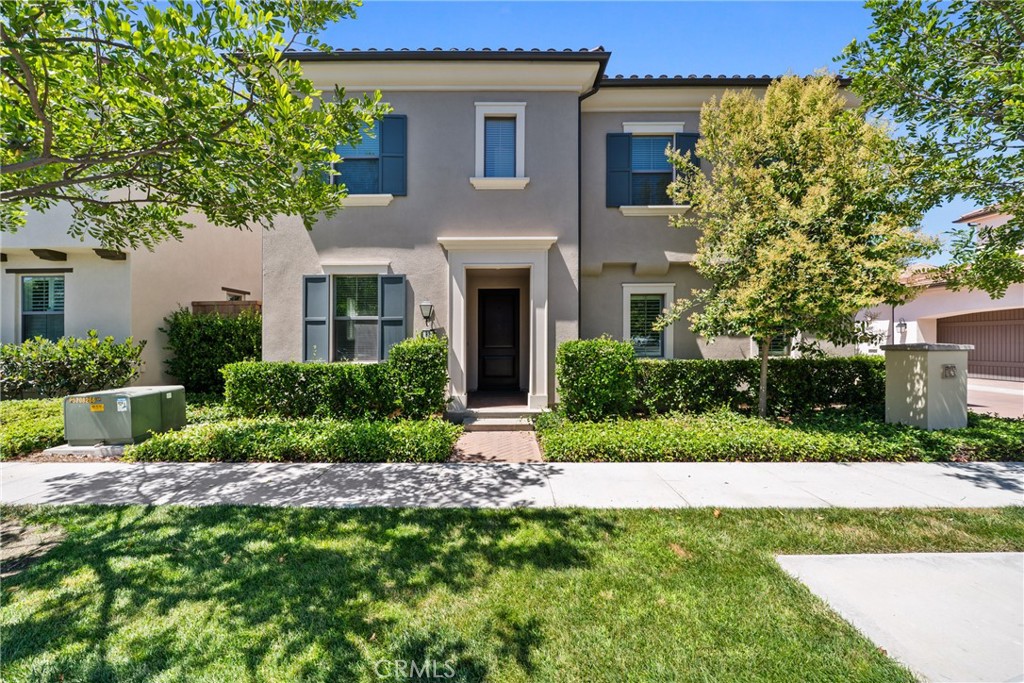 Welcome to this Mediterranean style detached home situated in the prestigious community of Eastwood Village, designed for an active Irvine lifestyle. This home features a large great room with 10' ceiling, chef-inspired gourmet kitchen with granite countertops and oversized island, first floor primary suite with coffered ceiling and walk-in closet, three and half well-appointed bathrooms, an office/4th bedroom, and a spacious loft for entertaining. The main living area boasts a bright and airy open floor plan with sliding door access to a private outdoor space, allowing for an abundance of natural sun light for year round enjoyment. Other notable elements include LED recessed lightings, custom fitted window treatment, stainless steel appliances, crown molding, and, a tankless water heater. Home is freshly painted with brand new carpet. Professionally designed courtyard with low maintenance landscaping completes this move-in ready home. Eastwood brings together family-friendly recreation, leisurely amenities and a great education. Residents of Eastwood Village are within a short distance to Eastwood Elementary School, Sierra Vista Middle School, Northwood High School, community parks (pools, tennis court, basketball and baseball, trails, soccer field, etc.), Shopping Centers, Irvine Spectrum, Kaiser, Hoag, and convenient freeway access.