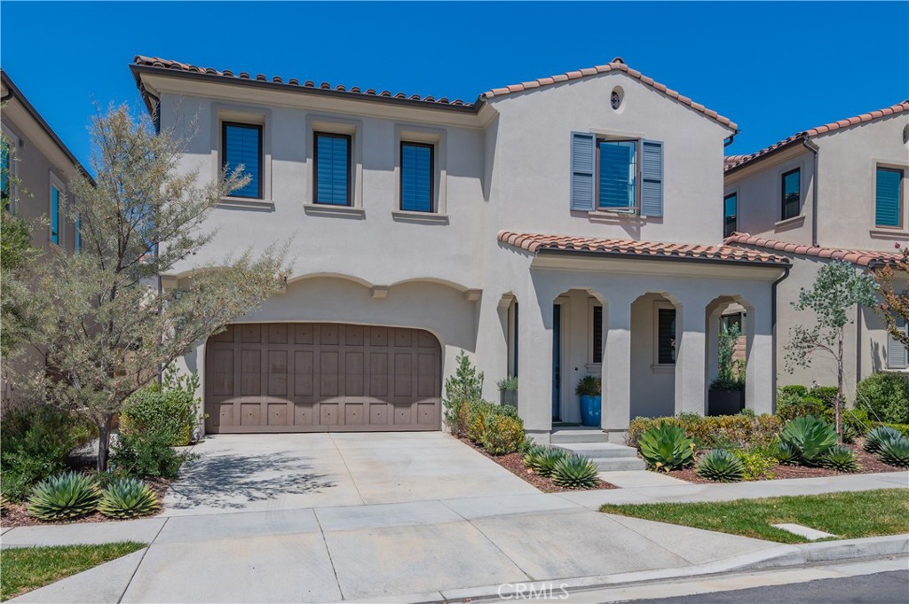 Located in the exclusive 24-hour guard-gated community of The Groves at Orchard Hills, this elegant Padova Italian-style residence offers comfort, luxury, and convenience. The home features 4 bedrooms, including a private guest suite on the main level, plus an upstairs entertainment loft—perfect for family living and visiting guests. The open-concept floor plan showcases a gourmet kitchen with an expanded chef’s island, quartz countertops with designer backsplash, professional-grade GE Monogram stainless steel appliances, custom pendant lighting, and abundant cabinetry. Filled with natural light, the interior is enhanced with plantation shutters, custom paint, and designer finishes throughout. The spacious master suite includes a luxurious spa-style bathroom and a walk-in closet. The inviting great room flows seamlessly into a charming conservatory and leads to a generously sized backyard featuring low-maintenance turf, professional landscaping, and a built-in firepit—ideal for outdoor entertaining. Community amenities include swimming pools, Jacuzzi, clubhouse, BBQ areas, tennis courts, and multiple parks. Conveniently located near Orchard Hills Shopping Center and within the award-winning Orchard Hills School District, this home offers the best of Irvine living.