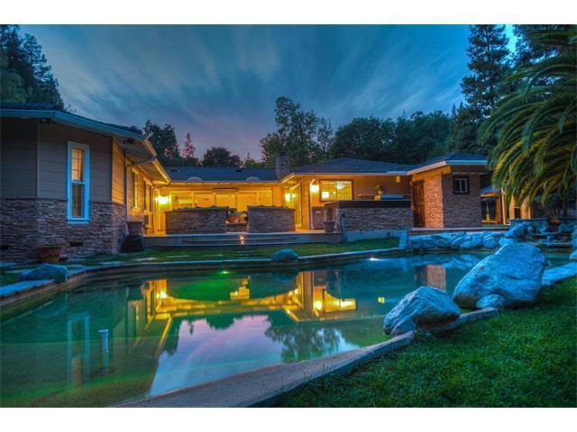 Gated estate in Woodside Hills area of Woodside. Located close to town with easy freeway access. Spacious home, beautifully remodeled custom kitchen, open dining/living room combination, separate family room plus a huge game room with bar. Large patio/BBQ area overlooking free-form pool, sport court & detached garage.