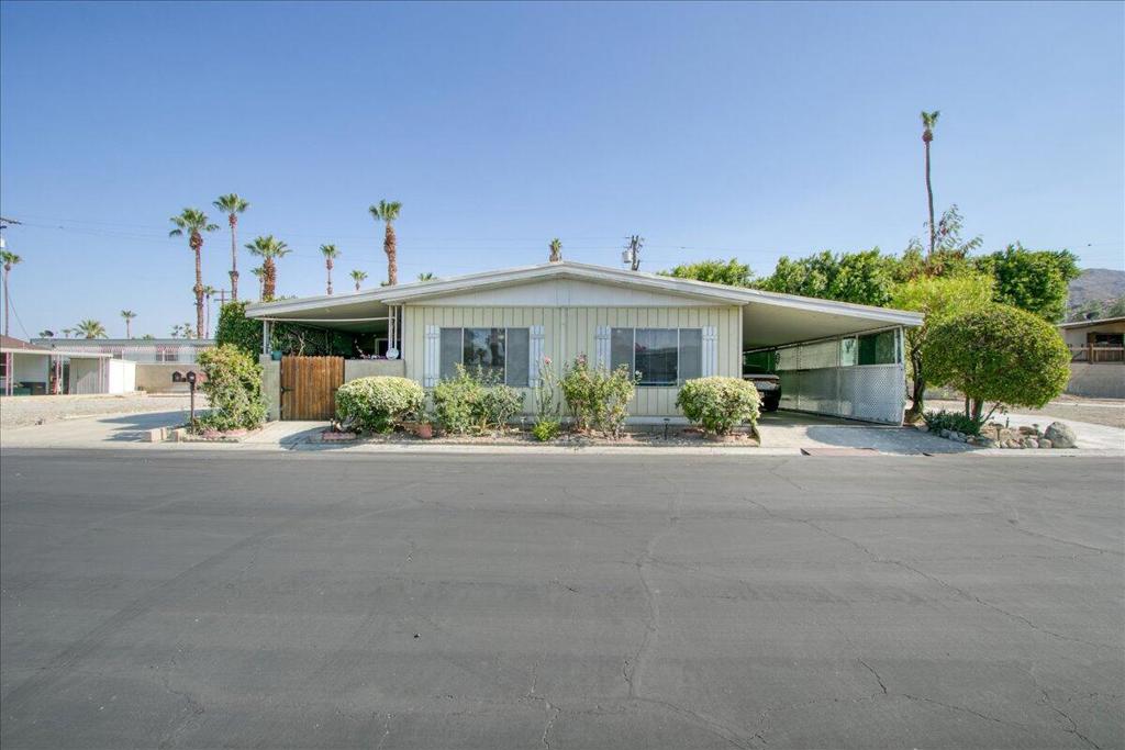 Welcome to your new home in the heart of Palm Springs! Located in the welcoming El Dorado Palm Estate, A delightful two-bedroom, two-bath home with added bonus room. You own the land here! Step inside a charming entry, kitchen,, upgraded floors that flow throughout the entire home, giving it a fresh and stylish feel. The expansive add-on great room, complete with its own walk in-closet, offers endless possibilities for relaxation and entertaining. Living here means convenience is at your doorstep. Just a short walk away, you'll find the community pool, perfect for cooling off on warm days. Shopping like Target, Trader Joes, and restaurants are all nearby, making everyday tasks a breeze. Imagine sipping your morning coffee or hosting friends on your private patio. Need extra storage? Two handy sheds has you covered. This home is ideally located near the park entrance, providing easy access to the gate for quick ins and outs. Enjoy all the best that Palm Springs has to offer in this prime location within El Dorado Palm Estate.
