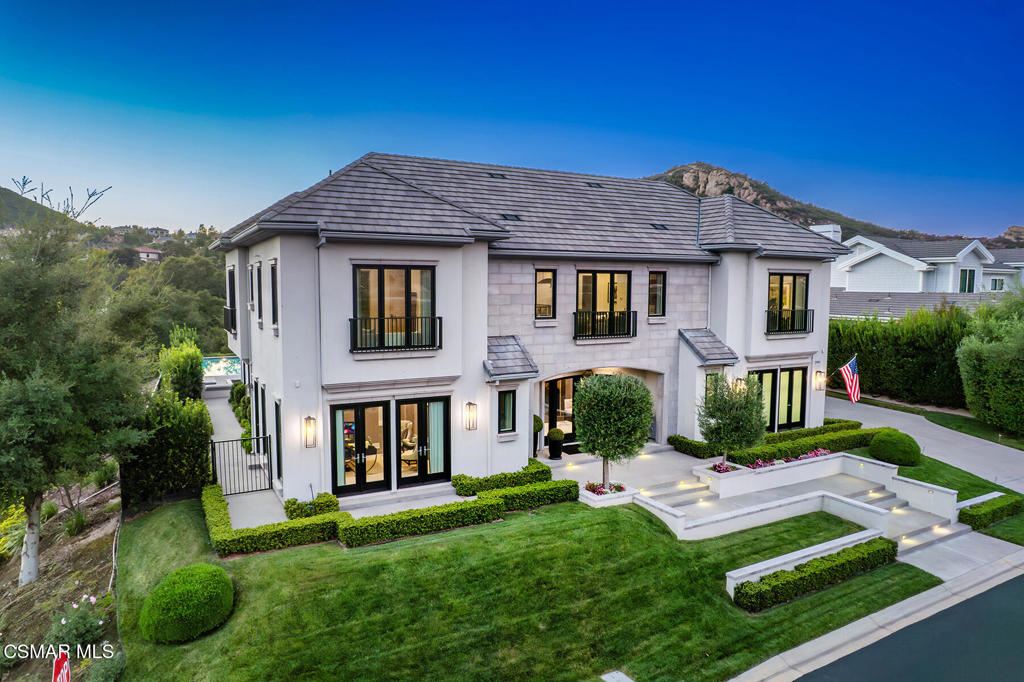 An incredible French Modern estate inside the guard gates of Sherwood Country Club -- where epic design meets outstanding luxury.Built in 2018 and spanning 6,172 sq ft, this showpiece residence offers 5 bedrooms, 4.5 baths, a loft-style lounge, and a sensational Great Room with pocket doors that disappear for seamless indoor-outdoor living. A striking custom light installation floats across the ceiling like art, setting the tone for the home's exceptional finishes and design detail.Designed by Cari Berg Interior Design, every space radiates modern sophistication--from the upholstered walls in the primary suite and office, to silk and suede wallcoverings, rich wood and slate floors, motorized draperies, and custom built-ins throughout.The spectacular chef's kitchen opens directly to the Great Room, creating the ultimate space for gatherings and everyday living. Outfitted with top-of-the-line appliances, custom cabinetry, and a large center island, it's as functional as it is beautiful.The main level also features a private office—perfect for working from home--and a comfortable den, ideal for a media room, library, or play space. A formal dining room with fireplace opens directly to the backyard, creating an effortless flow for entertaining.Upstairs, the primary suite is a true sanctuary, featuring a spa-inspired bath and a serene atmosphere designed for total relaxation.The resort-style backyard is next level--with a sparkling pool and spa, fire pit, built-in BBQ, covered outdoor living room, and a huge lawn wrapped in lush landscaping for complete privacy.Fully equipped with advanced home automation and a spacious 3-car garage, this home delivers cutting-edge comfort with jaw-dropping style.Located in one of Southern California's most prestigious communities, with Lake Sherwood access and optional membership to two elite country clubs.
