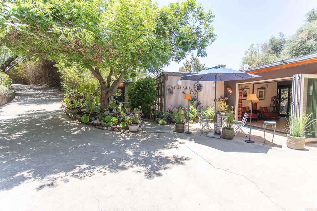 Fantastic Mid-Century Modern Escape! Your mood will transform the minute you come down the driveway. Enter into a lush sanctuary that is unlike anything in the area. You'll enjoy plenty of ultra-private space to spread out. Pay special attention to the unique and thoughtful custom design by La Jolla Architect Donald Brown. Original blueprints on-site and included with sale. Don't forget this home also has PAID solar! Custom addition of a piano studio/bonus room was just permitted this year, and is zoned to allow a legal home business with one additional employee. There is plenty of off-street parking with a custom concrete pad for 4 additional vehicles. Nothing in this home is cookie-cutter, and you'll want to soak in the charm all day long! Entertaining is a breeze with the gorgeous outdoor patios, decks and open space surrounding this property. The primary bedroom features an attached covered, enclosed patio with a private spa. Home is equipped with drip water and sprinklers, lights on timers, and an ample amount of outdoor storage space. You're going to love this property!