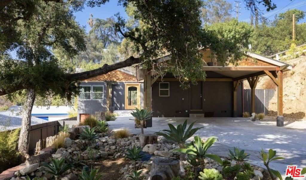 Available fully furnished from 10/1/25 to 2/15/26! Shaded by heritage oaks, you'll find this serene and airy hillside cabin-style home, bathed in natural light. It offers the feel of a private, Ojai-esque retreat, coupled with the best of Eagle Rock and Highland Park amenities, restaurants, and cafs at your fingertips. An ideal fit for those who crave the peace and serenity of nature along with walkability and convenience.Enter into an open-plan great room with high beamed ceilings, hardwood floors, and abundant natural light. The space flows into an eat-in country kitchen outfitted with top-of-the-line appliances, including a new Bosch dishwasher, dual ovens, a six-burner range, marble-top island and counters, and a wine fridge.Sliding doors lead to a large, shaded deck with an outdoor living and dining areacomplete with a fire pit and a viewextending to a landscaped private backyard with flat grass and terraced planting beds, all backing up to an uninhabited hillside.Back inside, the ground floor also features two bedrooms (one currently set up with a queen bed, the other as a nursery/child's room with a daybed for flexibility), a full bath, a half bath, a top-of-the-line washer and dryer, and a detached office.Float upstairs to a spacious, high-ceilinged primary suite, complete with walk-in closet, wet bar + mini fridge, and a spa-like full bath featuring a two-headed rain shower, oversized jacuzzi tub, and treetop views from a private balcony.Thoughtful touches throughout include Frame TVs (upstairs and down), wireless Sonos speakers in every roomincluding built-in ceiling speakers in the great rooma gated dual carport with EV charger, SoulCycle bike, zoned central HVAC, and a custom ADT security system.This light-filled home is tastefully furnished with everything you need for a luxurious SoCal indoor/outdoor lifestyle. Owners will provide weekly landscaping maintenance, and weekly cleaning service is available. The house is fully stocked with the owners' own beautiful entertaining ware, offering much more than your typical Airbnb or furnished listing -- a very rare opportunity for hosting truly memorable holiday dinners and gatherings!