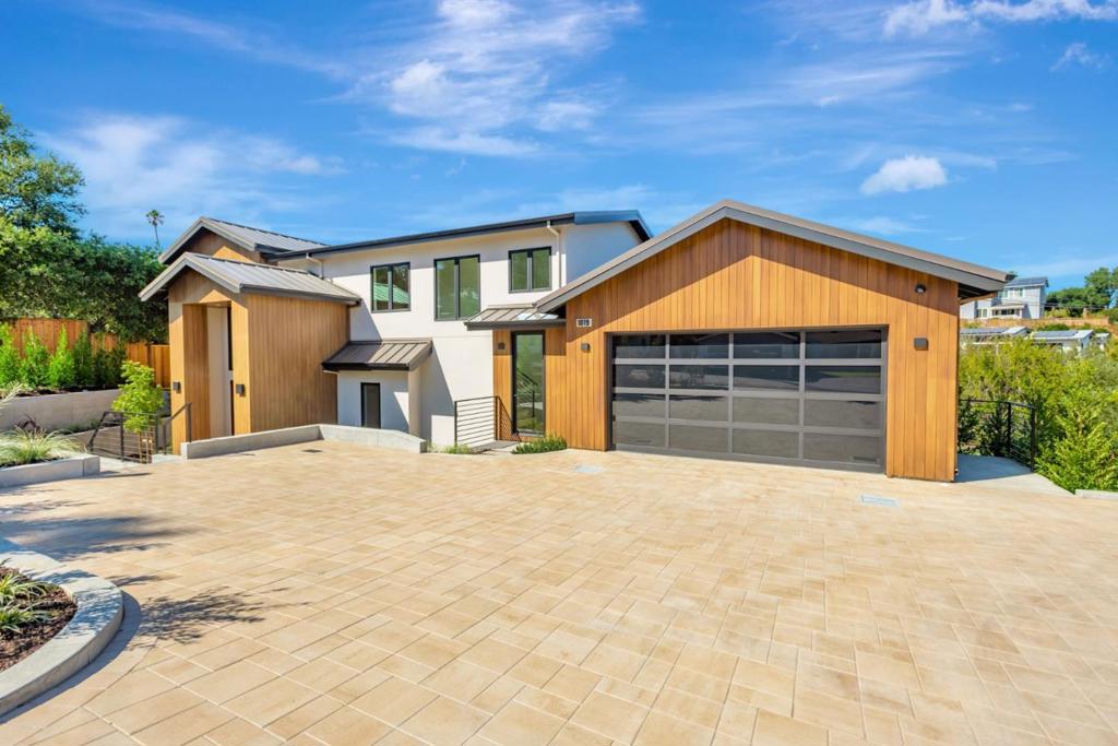 This beautifully designed 4-bedroom, 4.5-bathroom residence offers approximately 3,606 sq. ft. of living space on a generous 13,971 sq. ft. mostly level, park-like lot. A spacious two-car garage completes this thoughtfully crafted home. The gourmet kitchen is a chefs dream, featuring custom cabinetry, high-end stainless steel appliances, and a huge center island. The formal dining area flows seamlessly into the family room with its cozy fireplace and expansive multi-slide doors opening to the rear patioperfect for entertaining. The luxurious primary suite includes dual walk-in closets, a spa-like bath with soaking tub, double vanities, and a walk-in shower. Each additional bedroom is generously sized and offers its own private full bath. A dedicated laundry room with front-load washer and dryer adds convenience. Wide-plank hardwood floors, recessed lighting, and high ceilings enhance the homes modern elegance throughout. Outside, enjoy year-round gatherings on the covered patio with built-in barbecue and firepit, surrounded by the fully landscaped yard. Located near parks, golf, shopping, and vibrant downtown Redwood City, with top-rated Roy Cloud schools, this home offers the perfect combination of luxury, comfort, and convenience.