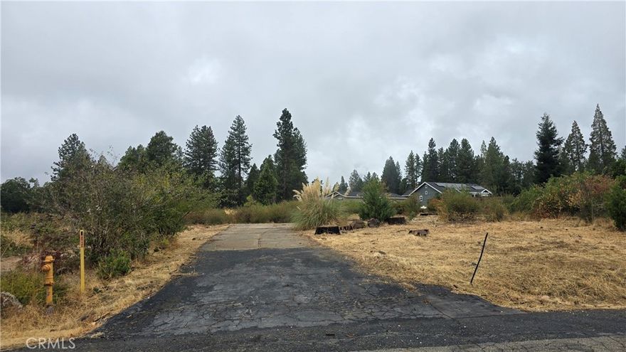 BEAUTIFUL .27 ACRE LOT ADJACENT TO OVER 400 ACRES OF NATURE PRESERVE LAND! This lot is a fantastic find and it has a gentle upslope from the street for extra views. Sitting at the end of the road where miles of walking trails & creek access begin, this lot offers lovely views and there is abundant wildlife that use the nature way as their safe zone too. This fabulous location has several new homes in the area as well as existing homes and that wonderful ambiance that you can only find in the mountains!! It is just about a mile to the Magalia Community Center and Disc Golf Course with a paved walking trail and more open space, the grocery store, multiple shopping options, post office and dining! Plus, it is a quick and easy commute down Skyway to Paradise & Chico. How about fishing & water sports and outdoor adventures? This lot is a short drive to Paradise Lake, DeSabla Lake, Lake Oroville Marina or the Feather River! Enjoy the benefits of being in the Paradise Pines Property Owners Association as well. You are only a short drive the clubhouse with association amenities including the clubhouse with meeting rooms & library, 2 event centers with full kitchens, full bar & lounge at clubhouse, pickle ball courts, bocce ball court, children's playground, hiking trails, swimming pool & spa and so much more! This lot is ready for your dream home!