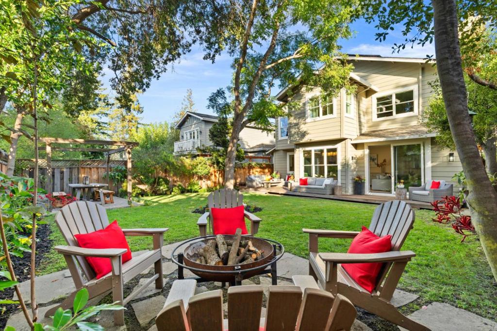 Nestled in the heart of Menlo Parks coveted Las Lomitas School District, this beautifully appointed 2,630 sq ft home blends timeless elegance with modern sophistication. A welcoming formal entry opens to an inviting living room with classic fireplace and a gracious formal dining room, ideal for both intimate dinners and festive gatherings. The open and spacious kitchen, thoughtfully designed with a center island and prep sink, flows seamlessly into the family room with its own fireplace framed by built-in bookshelves, both overlooking the park like, freshly landscaped backyard, firepit areaa serene retreat for entertaining, al fresco dining, or relaxed everyday living. The main level en suite with full bath provides flexibility for guests, multi-generational living, or a private home office. Upstairs, find three bedrooms, including a luxurious primary suite retreat with a walk-in closet and a spa inspired bath featuring an oversized soaking tub, dual vanities, and a glass enclosed shower, plus a convenient upstairs laundry room. With its elegant interiors, harmonious indoor-outdoor flow, premier location, walking distance to award-winning schools, vibrant downtown amenities, and nearby parks, this home captures the best of Menlo Park living!