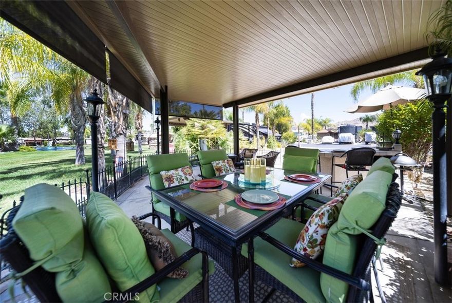 Welcome to Rancho California RV & Golf Resort *Site 42* This beautifully developed site is your own private oasis with a stream and water pond feature directly beyond the site in a park like setting with surrounding mountain views! Spacious alumawood patio cover with screens provides the perfect space for the RV Resort Lifestyle with dining, BBQ/kitchen featuring refrigerator, oven/cooktop, sink and sitting area with TV while soaking in the views. The site is fenced for pets and includes spacious parking for not only your RV but for golf cart and vehicles. Privacy shrubs on both sides of the site offer additional privacy. This truly park like setting is magical, peaceful and relaxing! Rancho California RV Resort provides amenities such as a 14 hole Executive PAR 3 Golf Course (no fees for owners), 5 Pools/Jacuzzis, Tennis courts, Pickleball courts, Dog park, Club house, hiking trails, Horseshoe lawn, onsite grocery market and restaurant. The resort is guard gated with no age restrictions. Monthly HOA fee includes "unlimited" use of the golf course, amenities, trash pickup at lot, water/sewer and common area maintenance. Financing is available!