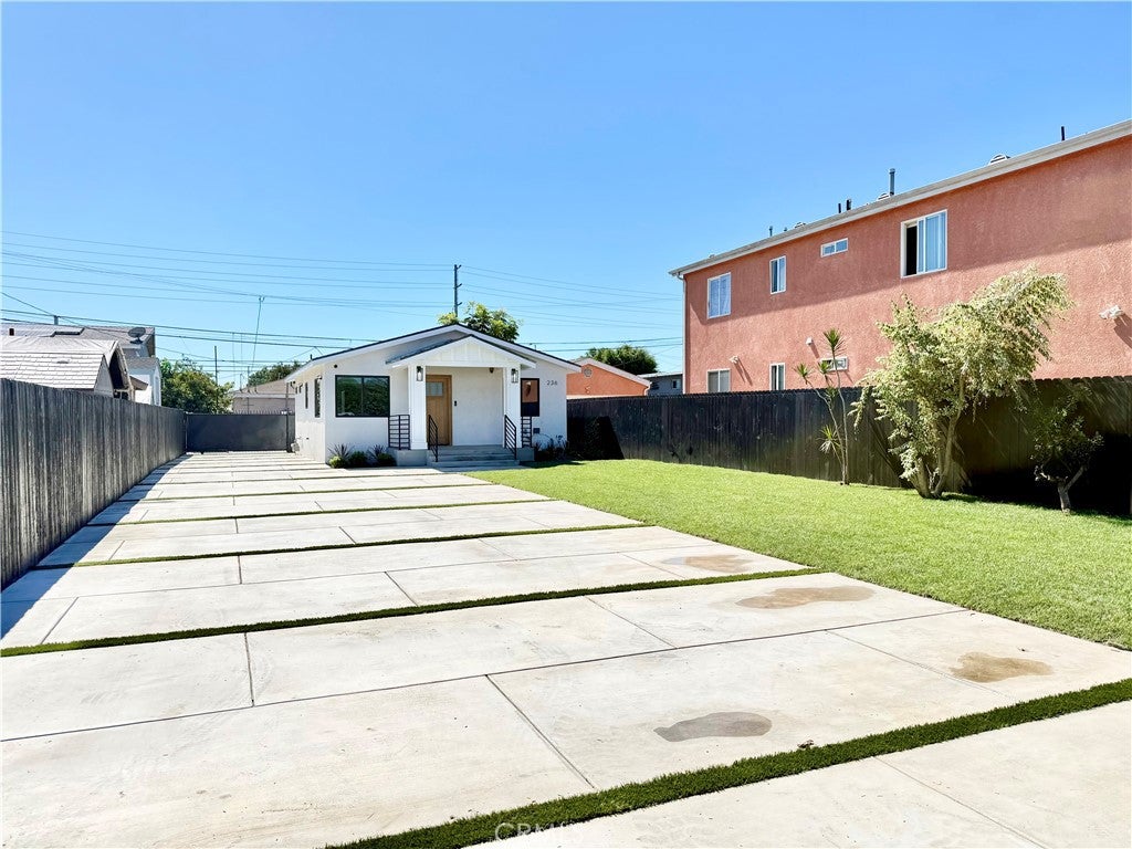 Photo of 236 E E 99th ST, Los Angeles, CA 90003 (MLS # DW26215150)