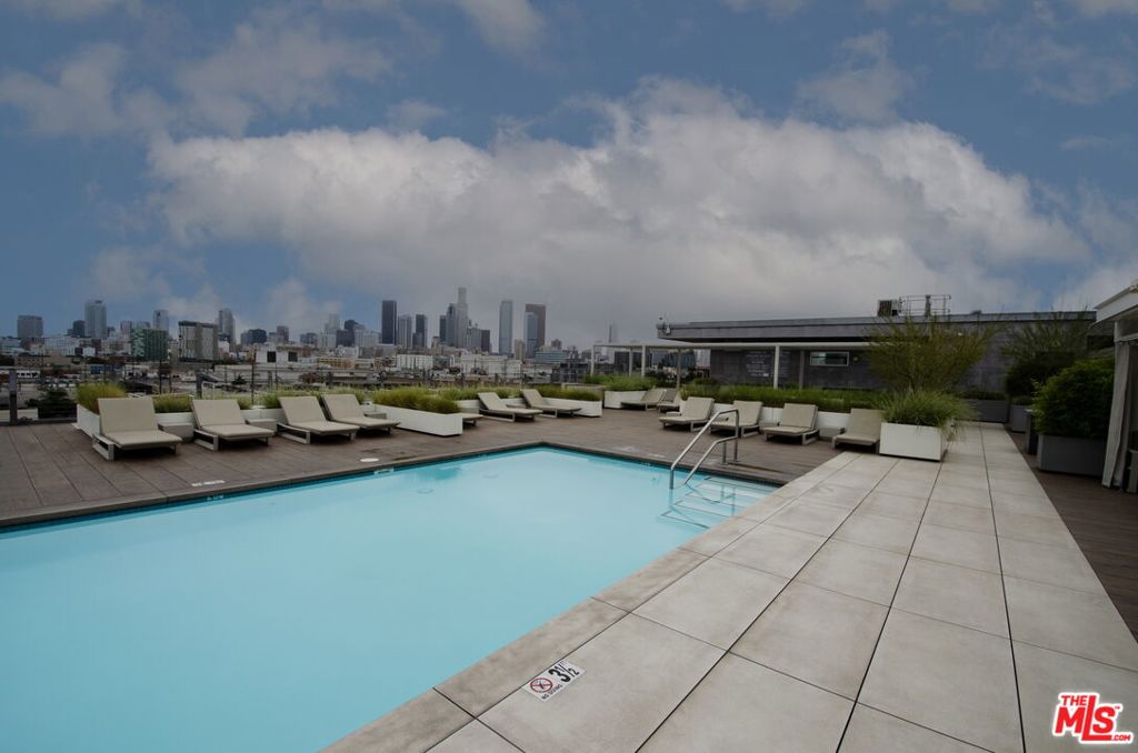 Prestigious DTLA Art's District Barker Block condo. Beautifully designed open concept 1 bed, 1 bath condo features modern kitchen with Quartz counter tops, Stainless Steel appliances and in unit washer and dryer. Bright and airy living area with exposed beams are nice touch of style. This unit also includes highly coveted extra 6' x 8' storage space in the building. Community amenities include gym, lounge areas and massive rooftop pool featuring the sweeping views of DTLA skyline. 24-hour on-site security for safety, gated parking, courtyard lounge, community BBQ and close to premier coffee shops, dinning, night life including Urth Cafe, Zinc Cafe & Market, Blue Bottle Coffee, Cafe Gratitude, Resident DTLA, Soho Warehouse, Arts District Park and more. DTLA living at its best.