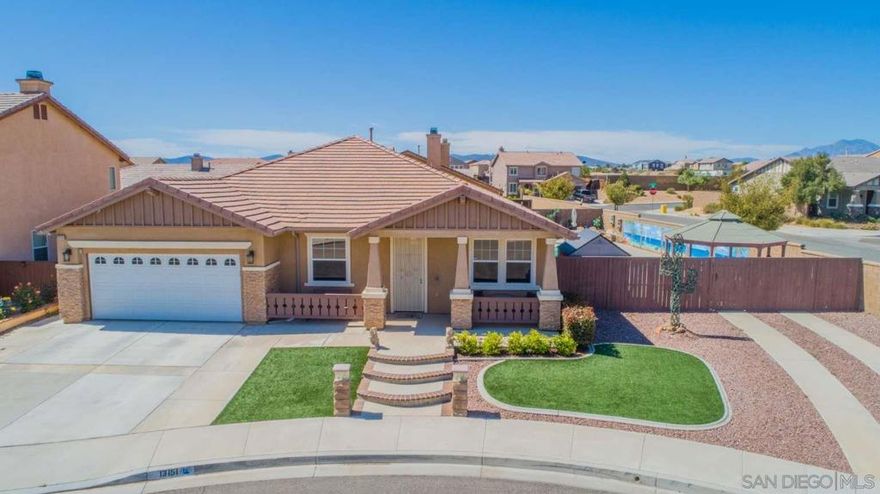Welcome to this stunning single-story pool home located at the end of a quiet Hesperia cul-de-sac with RV parking. Built in 2005, this pride-of-ownership property offers 2,364 sq. ft. of living space on a 10,397 sq. ft. lot with 4 bedrooms and 2 bathrooms. Inside, you’ll find a spacious formal living and dining room with tile flooring, plus a versatile office or optional 5th bedroom with custom French doors. The open-concept kitchen features granite countertops, a center island, stainless steel appliances, and a dining area that flows into the living room with a cozy fireplace. The primary suite includes a huge walk-in closet, and a bathroom with dual sinks, soaking tub, and separate shower, while three additional bedrooms and a guest bath with double sinks provide plenty of space for you and your guests. The backyard is perfect for entertaining with a sparkling pool, Jacuzzi, covered patio, fountain, gazebo, low maintenance landscaping turf and rock, lighting, large shed, and a beautiful 45-ft custom wall mural. Additional highlights include recessed lighting, ceiling fans in every room, tinted windows, an insulated garage door, attic stairs, and two sliding glass doors for easy outdoor access. Sun Run Solar 5.98 kW system installed in 2021. Conveniently located near schools, parks, restaurants, and with quick freeway access, this home truly has it all don’t miss the chance to make it yours!