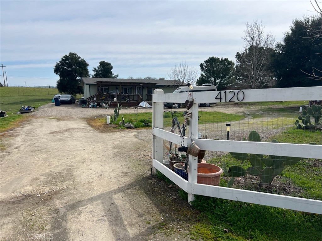 Paso Robles Country - Manufactured home on 2 usable acres, fully fenced with access from two streets, and several beautiful, mature oak trees. 3 bedrooms, 2 baths, an open floor plan, an indoor laundry room, and a detached storage unit. Front and back decks for those sunrises and sunsets. Call for your personalized property showing.