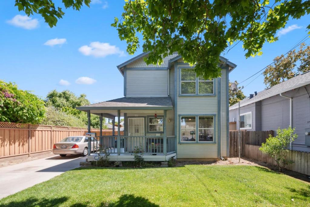Located on a picturesque tree-lined street with a strong sense of community, this 3 bedroom, 2 bath Modern Victorian offers 1,760 sqft of living space on a generous 5,875 sqft lot. Thoughtful updates include new LVP flooring, fresh interior paint, and updated kitchen countertops. The main level features the spacious primary suite with a full bathroom perfect for privacy, guests, or multi-generational living along with a conveniently located washer and dryer. The long driveway offers ample parking and leads to a detached garage, ideal for an ADU conversion, home office, or workshop. Enjoy the outdoor space with mature fruit trees providing both shade and charm. Leased solar panels help keep energy costs down, and the location offers unbeatable convenience with easy access to major freeways, public transportation, and all the tech hubs, dining, and entertainment downtown San Jose has to offer. This is a rare opportunity to own a home that offers space, flexibility, and location all in one.