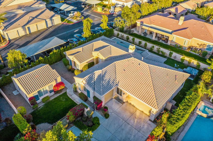 This beautiful private four bedroom four bath residence plus a detached casita with it's own bedroom and bath is located in the gated community of Desert Cove just across Ave. 48 from Rancho La Quinta. It features an eat-in kitchen with granite counter tops, built-in Stainless Steel appliances. There is a pass-thru to the dining area that will seat 8/10 easily and a large living room with fireplace and surround sound. The master bedroom opens to the rear covered porch and looks over the large grassy back yard with an above ground SPA. There is a half bath off the living room, separate laundry room and two bedrooms with a Jack & Jill bath. The low HOA fee covers trash, common area lighting and landscaping and beautiful Christmas decorations. Come take a look at this La Quinta gem, before it is gone