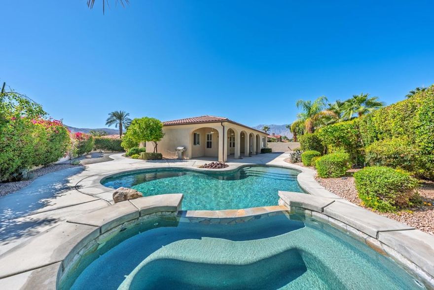 Move-in-ready and Owned Solar-power, this beautifully maintained home in the gated community of St. Augustine offers resort-style desert living on an oversized lot with pool and spa. Light-filled interiors flow seamlessly to outdoor entertaining spaces framed by mountain views. With a great floor plan and prime Rancho Mirage location--this is the perfect retreat for full-time or seasonal living. Welcome to this desert retreat located inside the sought-after gated community of St. Augustine in Rancho Mirage. This move-in-ready home sits on an oversized corner lot offering exceptional privacy mountain views and a resort-style backyard designed for true desert living. Through the gated private courtyard step inside to an inviting open floor plan with 2 bedrooms, Office/Den and 2 bathrooms, high ceilings, natural light, and generous living spaces create an effortless flow between the great room, dining area, and kitchen. The  kitchen features white cabinetry, granite countertops, stainless-steel appliances and a large island perfect for entertaining. The spacious great room showcases a custom fireplace and a french door that leads to the expansive outdoor living area. Outdoors, you'll find the ultimate entertainer's oasis--complete with a sparkling pool and spa, fire pit, multiple lounging areas, and mature desert landscaping that perfectly complements the home's architectural lines. The property's OWNED solar system keeps energy costs low year-round. The primary suite offers peaceful separation, new carpet, a spa-inspired bath, and direct patio access for seamless indoor-outdoor relaxation. The guest room is a nice size also with new carpet and the flexible den/office (or 3rd bedroom) provides space for remote work or hobbies. A two-car garage and ample driveway add convenience, while the home's pristine condition means there's nothing left to do but move in and start enjoying the best of desert living. St. Augustine is a prestigious Rancho Mirage community known for its walking paths, tennis and pickleball courts, and lush greenbelts--all surrounded by mountain vistas and just minutes from world-class golf, dining, and shopping along El Paseo.