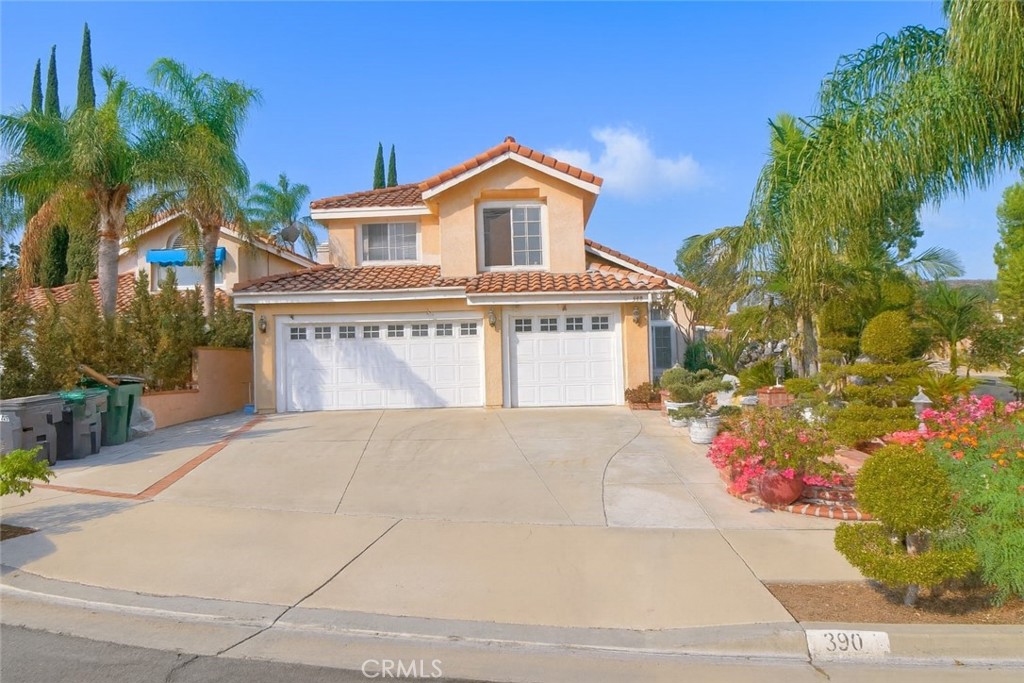 Beautiful 4BR/3BA lease in Corona! This spacious two-story home offers 2,603 sq ft with soaring ceilings, abundant light, and an open floor plan. Features include a cozy fireplace, updated kitchen with granite counters, and a large primary suite. Enjoy lush front landscaping, tranquil ponds, and a 3-car garage. The backyard retreat boasts mature palms, a koi pond, and covered patio. Convenient to freeways, shopping, parks, and top-rated schools.