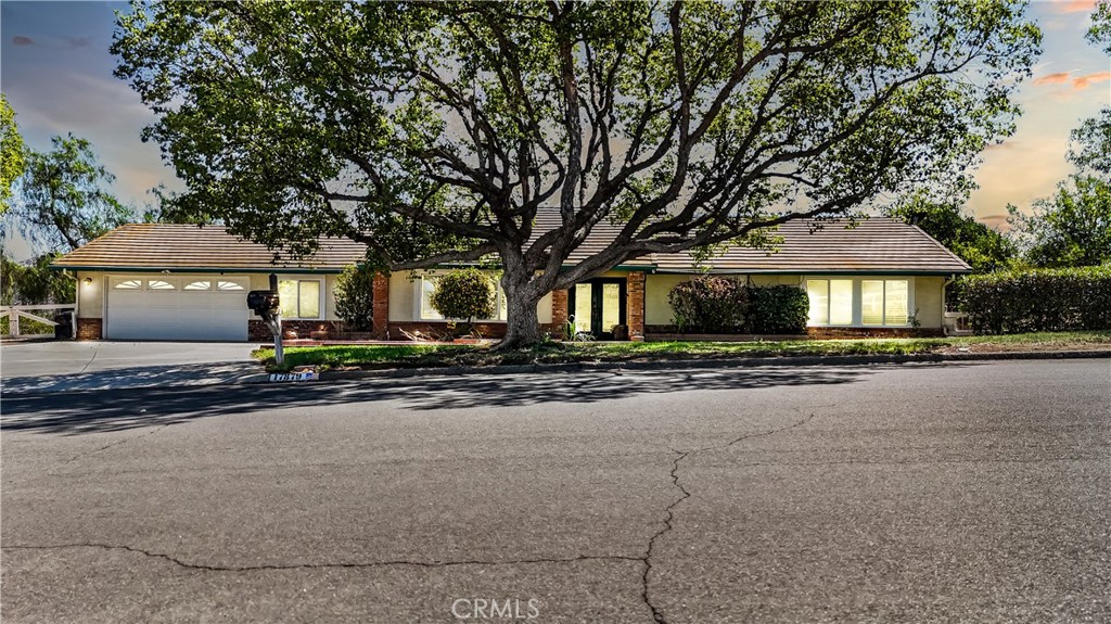 Versatile single-level Ranch home in the highly sought-after Gavilan Hills community! Pride of ownership shows throughout this 3 bedrooms and 2 bathrooms across approximately 1,847 sq. ft. of living space, this property also includes a bonus insulated sunroom and additional finished space in the garage—providing remarkable versatility for today’s lifestyle needs.
Designed with both comfort and sustainability in mind, the home features a paid-in-full high-efficiency solar system, a whole-house generator with oversized propane tank, and a whole-home water purifier. Inside, the upgraded kitchen showcases custom cabinetry, granite countertops, a designer copper range hood, and pot filler. The bathrooms have been tastefully updated with quartzite counters, while the spacious primary suite includes a walk-in closet.
Set on 1.88 acres of mostly flat, usable land, the property is perfectly suited for entertaining, gardening, or accommodating animals (zoned for horses). Outdoor highlights include a covered patio with remote-operated solar shades, a brand-new wooden deck, lush landscaping, mature fruit trees (lemon, orange, grapefruit, tangelo, pear), a garden shed, and a large barn.
With immediate access to miles of horse trails and a nearby community equestrian center, this home offers the best of country living while maintaining modern efficiency. Rarely does a property combine sustainability, versatility, and natural beauty so seamlessly