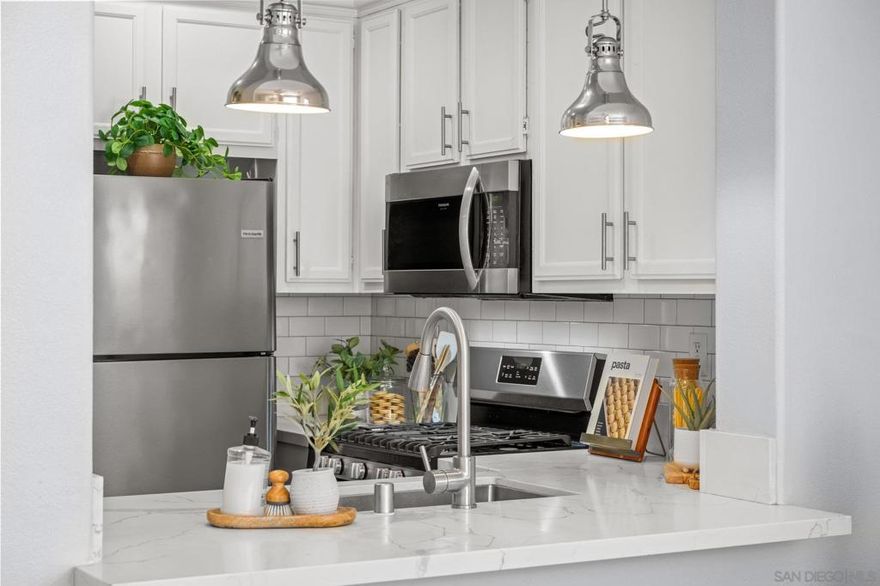 Turnkey! Private townhome with no front neighbors, abundant natural light, and attached 2-car garage. Primary suite on main level, features luxury vinyl plank flooring, barn door, stainless steel appliances, and stackable washer/dryer. Laminate flooring throughout. Outdoor spaces include a first-floor patio and second-level balcony. Community pool and spa.  Rancho Carrillo offers the perfect blend of convenience and natural beauty. Miles of walking trails and the Rancho Carrillo Swim Center complete with heated pool, spa, and clubhouse. Bressi Ranch Square just a stone's throw away, featuring a variety of fantastic restaurants such as Tommy V's, Giola, Casero, Panini Grill, Mendocino Farms, and Board & Brew. You'll also find all your shopping essentials nearby, with Trader Joe's, Stater Bros, Sprouts, Bevmo, CVS, Target, and Starbucks just around the corner. If you're looking to explore the great outdoors, Rancho Carrillo provides hiking trails for outdoor enthusiasts. Additionally, the historic Leo Carrillo Ranch is a treasure nearby, offering a glimpse into the past, a chance to explore the grounds, learn about Leo Carrillo himself, and partake in community events hosted by the City of Carlsbad.