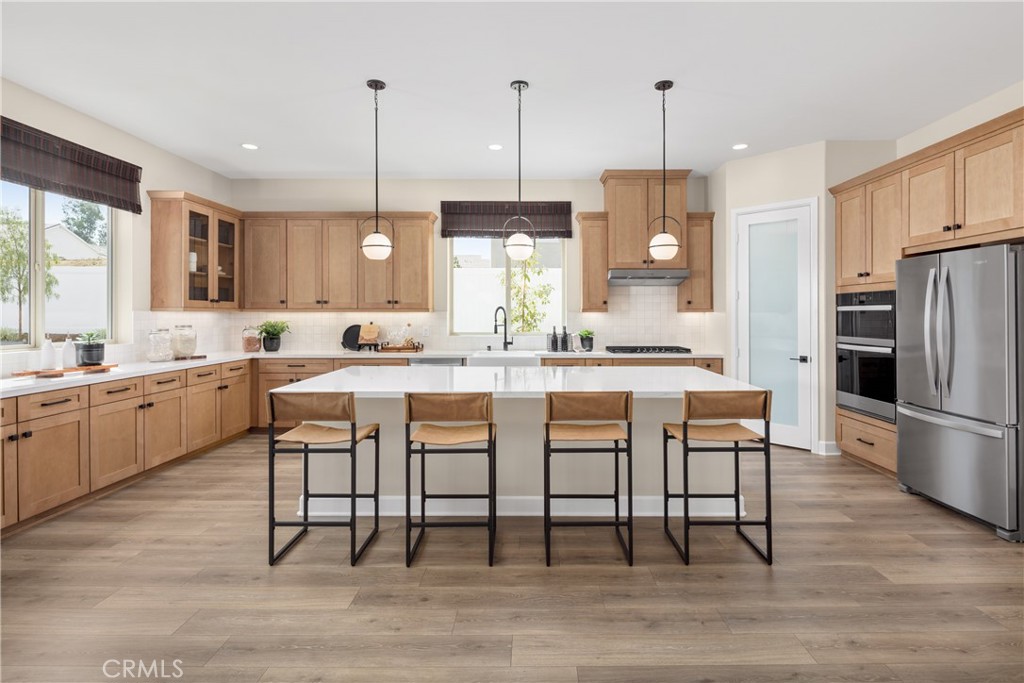 Spacious, Modern Living in a Prime South Redlands Location with No HOA. Ask about limited-time incentives and flexible options that may help reduce closing costs or monthly payments. This beautifully designed two-story home blends everyday practicality with elevated finishes, offering 5 bedrooms, 4.5 bathrooms, and flexible spaces for how you live today. Downstairs, an open-concept Great Room, Dining, and Kitchen layout makes entertaining easy. The Kitchen features an oversized island, walk-in pantry, and stylish finishes, while a downstairs bedroom suite with private bath is perfect for guests or extended family. Upstairs, a generous Loft separates the Primary Suite from the secondary bedrooms, giving everyone their own space. The Primary Suite features a spa-style bathroom, large walk-in closet, and great natural light. Three additional bedrooms—each with their own bath access and walk-in closets—offer flexibility for work-from-home, family, or hobby space. The Laundry Room is thoughtfully located upstairs for convenience. Other smart details include a walk-in storage closet under the stairs, dual sinks in multiple baths, and a spacious 2-car garage. Built by Beazer Homes, the nation’s #1 builder of DOE-certified Zero Energy Ready Homes, this home is designed for comfort, cleaner indoor air, and energy efficiency that supports your lifestyle long term. Includes a high efficiency water heater, dual-zone HVAC that includes a clean air ERV system and 1-year fit and finish warranty for added peace of mind. Ask about quick move-in availability and flexible financing incentives that can help reduce closing costs or monthly payments.