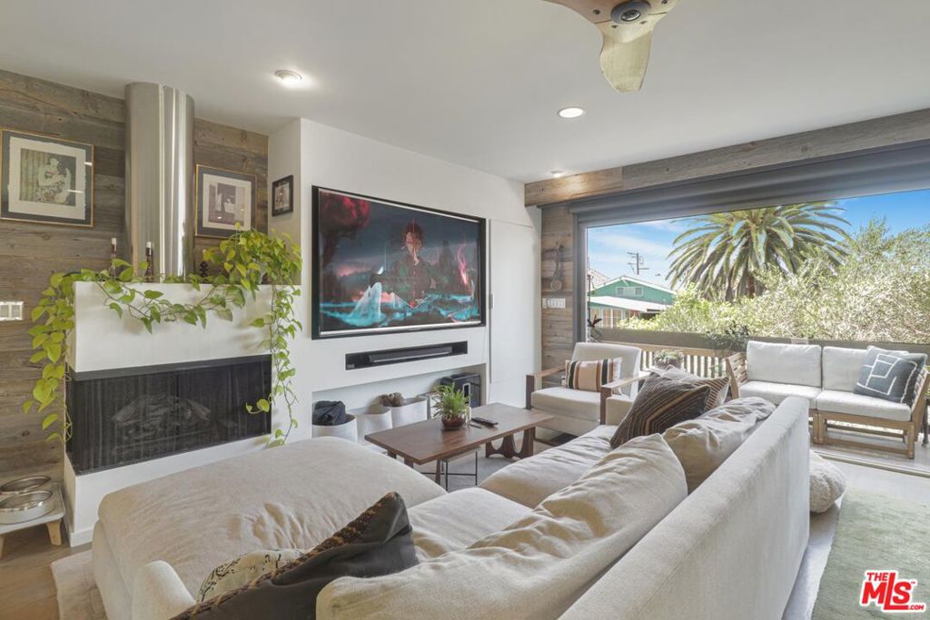 VENICE JEWEL! Top Floor! Sophisticated Pied-a-Terre that exudes character. Impeccably designed, Custom remodel on a highly sought after Walk-Street This Hidden Gem behind the gated courtyard features Walls of warm reclaimed wood line the architectural interior, while expansive Nana wall doors open the living room to views of the Santa Monica Mountains. Equipped w/ a professional-grade entertainment system Enjoy the gourmet galley kitchen extensive butcher block counter aligned with European conveniences such as Thermador stove, Viking & Miele appliances, as well as a spa-like Primary bathroom w/ custom granite, heated towel racks, steam shower & jet tub. This is no typical condo! Other home like features include inside full-size washer dryer, 2 car dedicated garage parking w/ a bonus guest spot, a rooftop deck w/ 360 views, bar, shaded cabana Separate large storage room. Just steps away from the beach, Abbot Kinney, Main Street & the Boardwalk, fine dining, shopping, minutes to Santa Monica. Live in one of the hippest neighborhoods on the Westside! This is Venice living at its best!