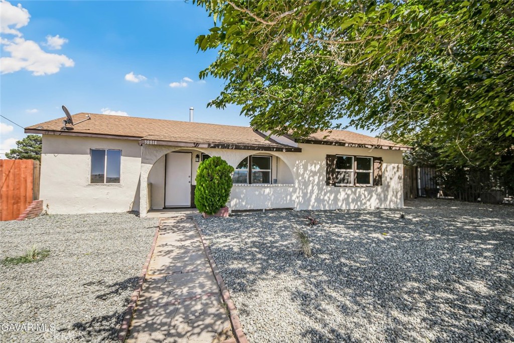This beautifully renovated home is move-in ready and boasts fresh full interior and exterior paint, creating a crisp and inviting atmosphere throughout. Step into the completely updated kitchen, featuring brand-new cabinets, countertops, stainless steel appliances, sink, modern plumbing fixtures, and a garbage disposal, perfect for both daily living and entertaining. The home showcases brand-new vinyl plank flooring that flows seamlessly through every room, paired with new light fixtures and updated plumbing fixtures for a modern touch. The bathroom has been tastefully remodeled with a new vanity, toilet, custom tile shower surround, and stylish new lighting. Additional highlights include some newer vinyl windows, beautiful beamed ceilings that add warmth and character, and new closet doors. Outside, you'll find a fully fenced yard in both the front and back, a rock landscape in the front with fresh new stone, and a covered front porch for relaxing. The backyard is large and versatile, offering plenty of space for outdoor activities, gardening, or entertaining, with convenient back access through a large gate. Situated in an excellent location with easy access to amenities, this is truly a rare offering—come see this incredible property today!
