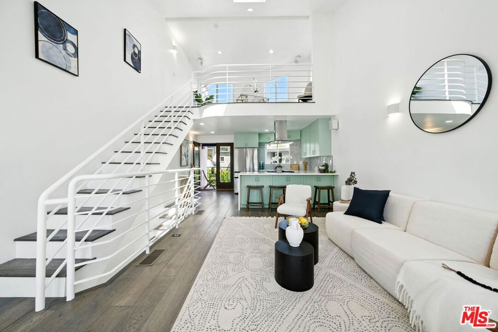 Wake up to ocean views and end your day with breathtaking sunsets in this standout two-bedroom plus loft townhome in the heart of Ocean Park, Santa Monica. Ocean views from almost every area! Just two blocks from Main Street and moments from the sand, this three-level home feels like a modern beach treehouse, bright, open, and full of soul. Remodeled with a crisp, elevated touch, the kitchen and baths were reimagined to bring function and style into perfect balance. Skylights and oversized windows invite sunlight to spill in from every angle while leafy eucalyptus branches frame sweeping views toward Malibu. The versatile third-floor loft, with its ocean backdrop, is an inspiring space for work, guests, or winding down. With four private outdoor patios, you'll catch every breeze and golden hour glow. Gated side-by-side parking, in-unit laundry, central A/C, generous storage, and a warm, friendly community add to the ease of everyday life. Plus, you're just steps from Hotchkiss Park and all the energy of Ocean Park, including cafs, boutiques, yoga, and the weekly Farmers Market. This is the kind of place that feels good the second you walk in. Don't miss your chance to make it yours.