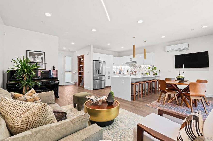 Cantera is one of La Mesa’s coolest hillside enclaves with one way in and out for privacy and just minutes from downtown! Built in 2024 this La Mesa premier detached upgraded home features soaring ceilings, LED lighting, and panoramic dual-pane windows in an open-concept layout. The gourmet kitchen boasts GE Café appliances, quartz countertops, custom cabinetry, and premium fixtures. This open floor plan is perfect for every day living and for entertaining. Owners have added custom built-ins, smart home tech, and designer finishes for a truly refined space. Eco-friendly amenities include fully-owned solar panels, a Tesla EV charger, tankless water heater, upgraded Samsung single unit washer/dryer and energy-efficient HVAC. Enjoy private outdoor living with a covered carport, scenic patio, and custom landscaping in a low-density, HOA-maintained community. Walk to La Mesa Village, Collier Park, and Spring Street Trolley—plus quick freeway access. Upstairs, you'll find spacious bedrooms with upgraded storage and a modern bath featuring luxury tile and sleek fixtures. Discover Cantera—upgraded luxury, green living, and hillside charm, move-in ready!