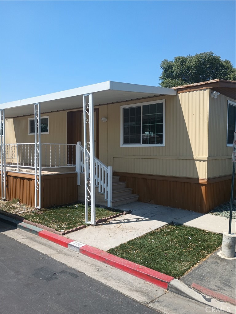 Welcome to this charming 3 bed 2 full bath manufactured home in the heart of Rialto. It sits on a corner lot in an all-age park within a friendly community. This stunning mobile home has been completely upgraded and remodeled from top to bottom, and it's move in ready! It offers modern-style and comfort Upgrades that are included as follows drywall, fresh paint interior and exterior, plumbing and electrical. New 5ton AC with a 10-year manufacture warranty, A new 40-gallon water heater with warranty. Kitchen has high end appliances installed with manufacture warranties. Kichen cabinets are soft close, with quartz countertops and a 9ft island. Tile and waterproof laminate flooring in all bedrooms. Recessed lighting throughout, walk-in closet in primary bedroom and walk-in beautiful ceramic showers include a handheld shower along with seating, storage space included in laundry area. New layer of asphalt coating in driveway. Outside shed and Covered parking space. Don't miss your opportunity to make this wonderful home yours.