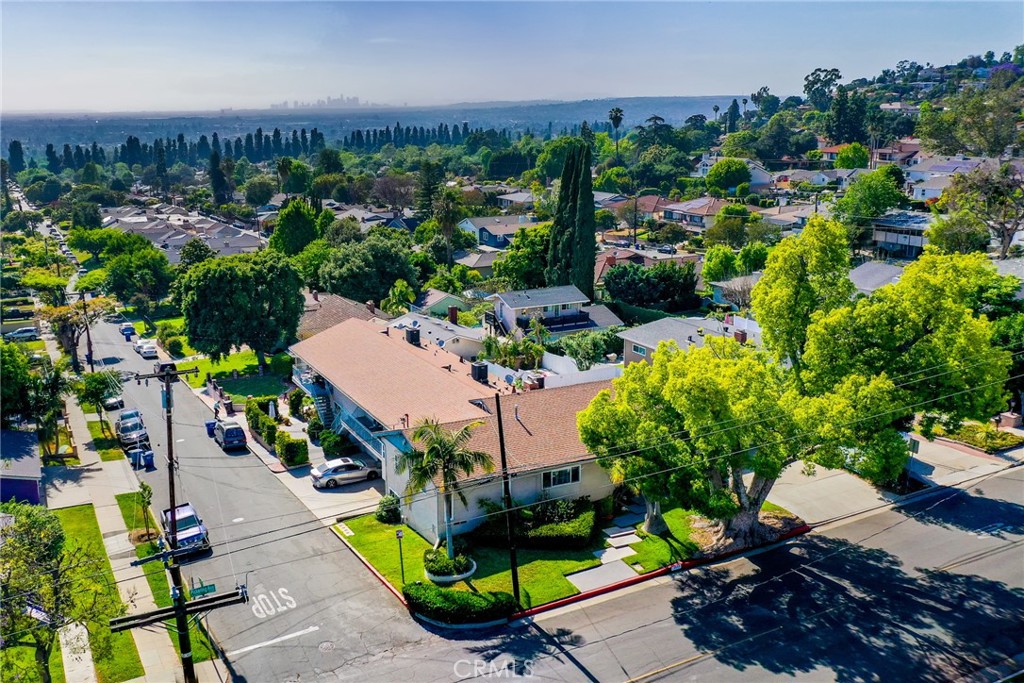Welcome to 5655 Pickering Avenue, a rare fourplex property in the sought after 90601 foothills of Whittier. On a generous 12,101 SF lot, this well-maintained 4,949 SF multifamily offering includes three 2-bedroom apartment style units and one 2-bedroom home with a bonus office. The home and one apartment each enjoy private yard space, while the other two units share a landscaped common area. Each unit features garage parking and dedicated storage, adding convenience and functionality.
Ideally located within walking distance to Uptown Whittier and close to major freeways, this property also boasts breathtaking views from Downtown LA and the Hollywood Sign all the way to Catalina Island.
With FHA financing available, you can own this with $84,000 DOWN! This is a rare opportunity for investors or owner/occupants to secure a high demand asset in a prime location with long term upside.