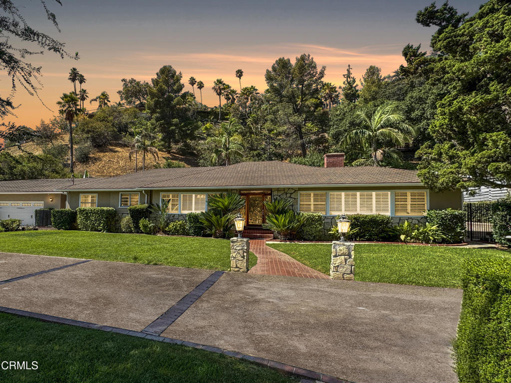 Tucked behind secure gates in the peaceful Glendale Hills, this beautifully updated single-level ranch delivers the perfect blend of privacy, comfort, and indoor-outdoor living. A spacious motor court and timeless stone-accented facade set the stage for what's inside.Step through the beveled glass entry door into a bright, welcoming interior. The living room is filled with natural light and anchored by a classic marble fireplace. Across the way, the formal dining room opens to a chef-inspired kitchen with quartz countertops, stainless steel appliances--including double convection ovens, gas cooktop, range hood, dishwasher--and designer fixtures. The kitchen and breakfast nook overlook the motor court, while the adjoining family room impresses with vaulted ceilings and French doors that lead to a large covered patio--an ideal spot for alfresco dining and entertaining.Beyond the patio, a gated pool and spa are surrounded by lush landscaping and a serene hillside backdrop. Inside, the private bedroom wing is thoughtfully designed: the primary suite offers generous closet space and an updated en suite bath; a second bedroom opens directly to the pool through French doors; and a third bedroom enjoys patio access, sharing a full bath with the second bedroom. A convenient laundry room with exterior access, powder room, and separate garage half-bath for poolside use add everyday functionality.Additional highlights include LED recessed lighting, crown molding, hardwood floors throughout, citrus trees, and a 4-car garage with built-in storage.Ideally located minutes from Verdugo Park, Oakmont Country Club, Montrose Shopping Park, and with easy access to The Americana at Brand, Glendale Galleria, Pasadena, Burbank, and DTLA--this rare lease opportunity combines modern upgrades, classic character, and a tranquil hillside setting.